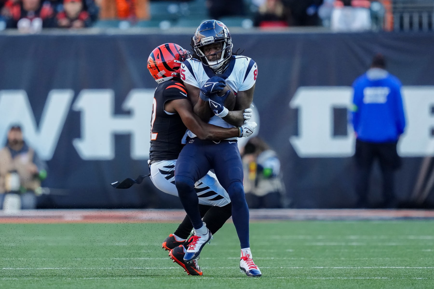 CINCINNATI, OHIO - NOVEMBER 12: Noah Brown #85 of the Houston Texans makes a catch while being tackled by Chidobe Awuzie #22 of the Cincinnati Bengals in the fourth quarter at Paycor Stadium on November 12, 2023 in Cincinnati, Ohio. (Photo by Dylan Buell/Getty Images)