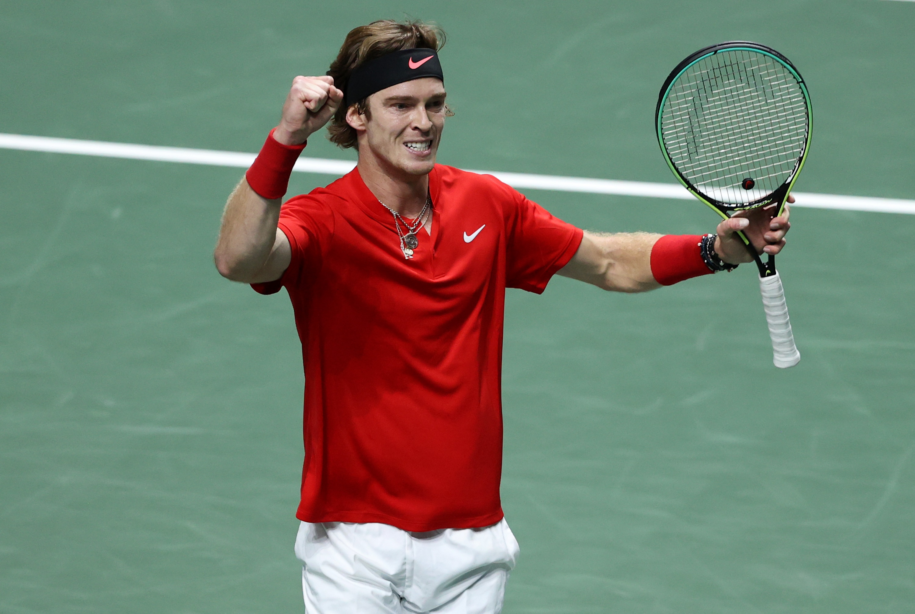 MADRID, SPAIN - DECEMBER 02: Andrey Rublev of Russian Tennis Federation celebrates winning match point against Elias Ymer of Sweden during the Davis Cup Quarter Final between Russian Tennis Federation and Sweden at Madrid Arena on December 02, 2021 in Madrid, Spain. (Photo by Clive Brunskill/Getty Images)