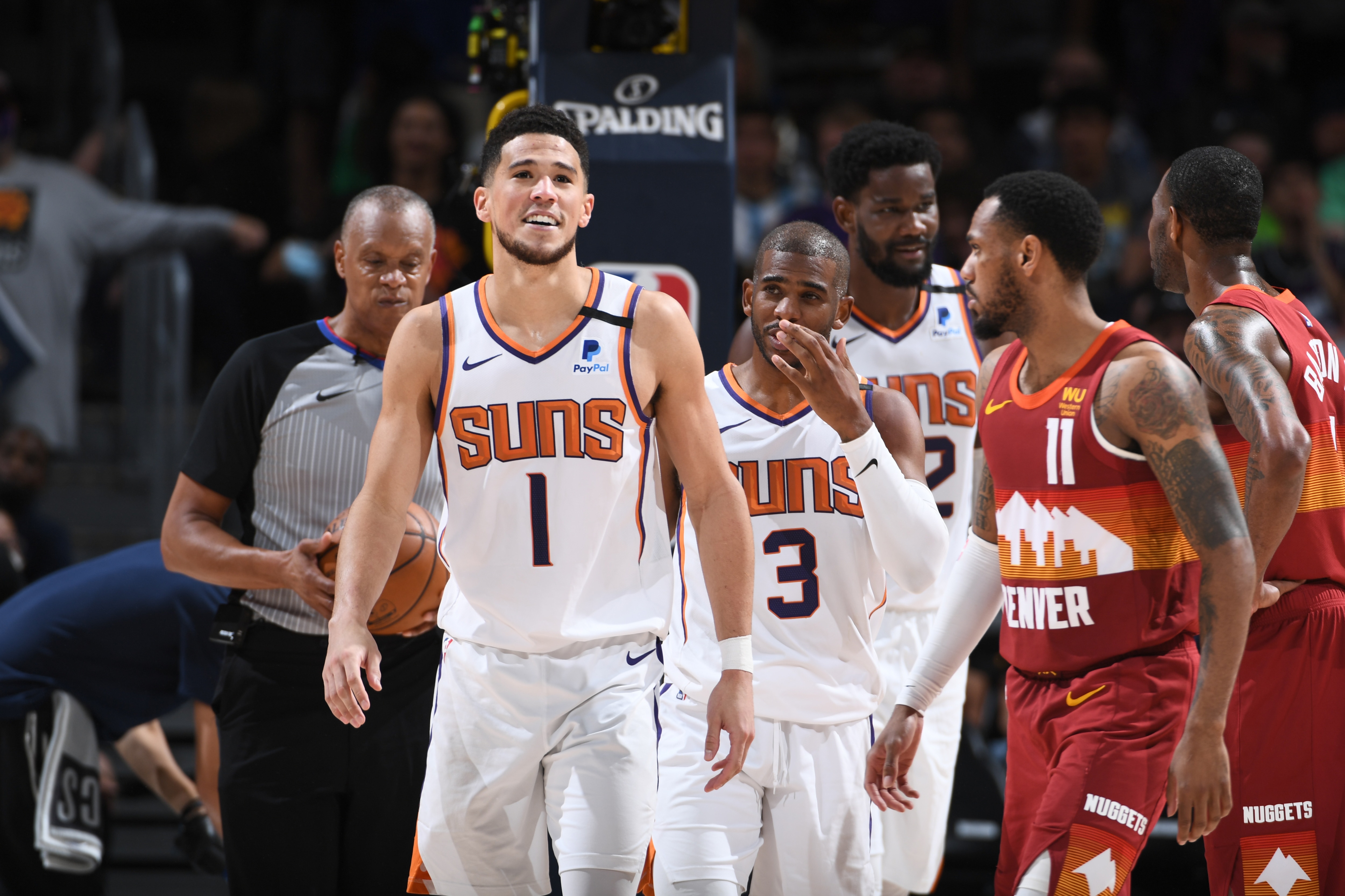 DENVER, CO - JUNE 13: Devin Booker #1 of the Phoenix Suns smiles during the game against the Denver Nuggets during Round 2, Game 4 of the 2021 NBA Playoffs on June 13, 2021 at the Ball Arena in Denver, Colorado. NOTE TO USER: User expressly acknowledges and agrees that, by downloading and/or using this Photograph, user is consenting to the terms and conditions of the Getty Images License Agreement. Mandatory Copyright Notice: Copyright 2021 NBAE (Photo by Garrett Ellwood/NBAE via Getty Images)