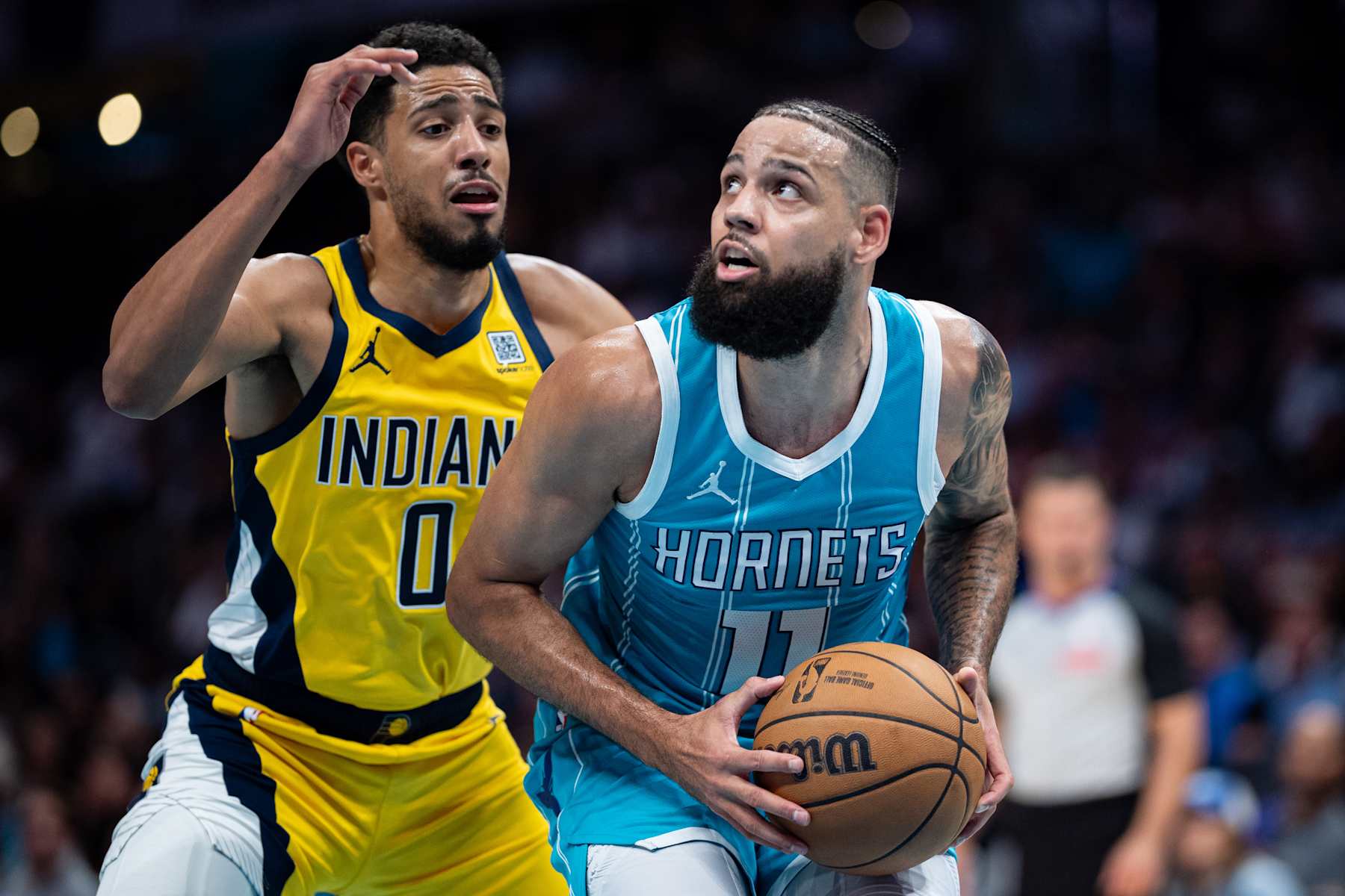 CHARLOTTE, NORTH CAROLINA - NOVEMBER 08: Tyrese Haliburton #0 of the Indiana Pacers guards Cody Martin #11 of the Charlotte Hornets during their game at Spectrum Center on November 08, 2024 in Charlotte, North Carolina. NOTE TO USER: User expressly acknowledges and agrees that, by downloading and or using this photograph, User is consenting to the terms and conditions of the Getty Images License Agreement. (Photo by Jacob Kupferman/Getty Images)