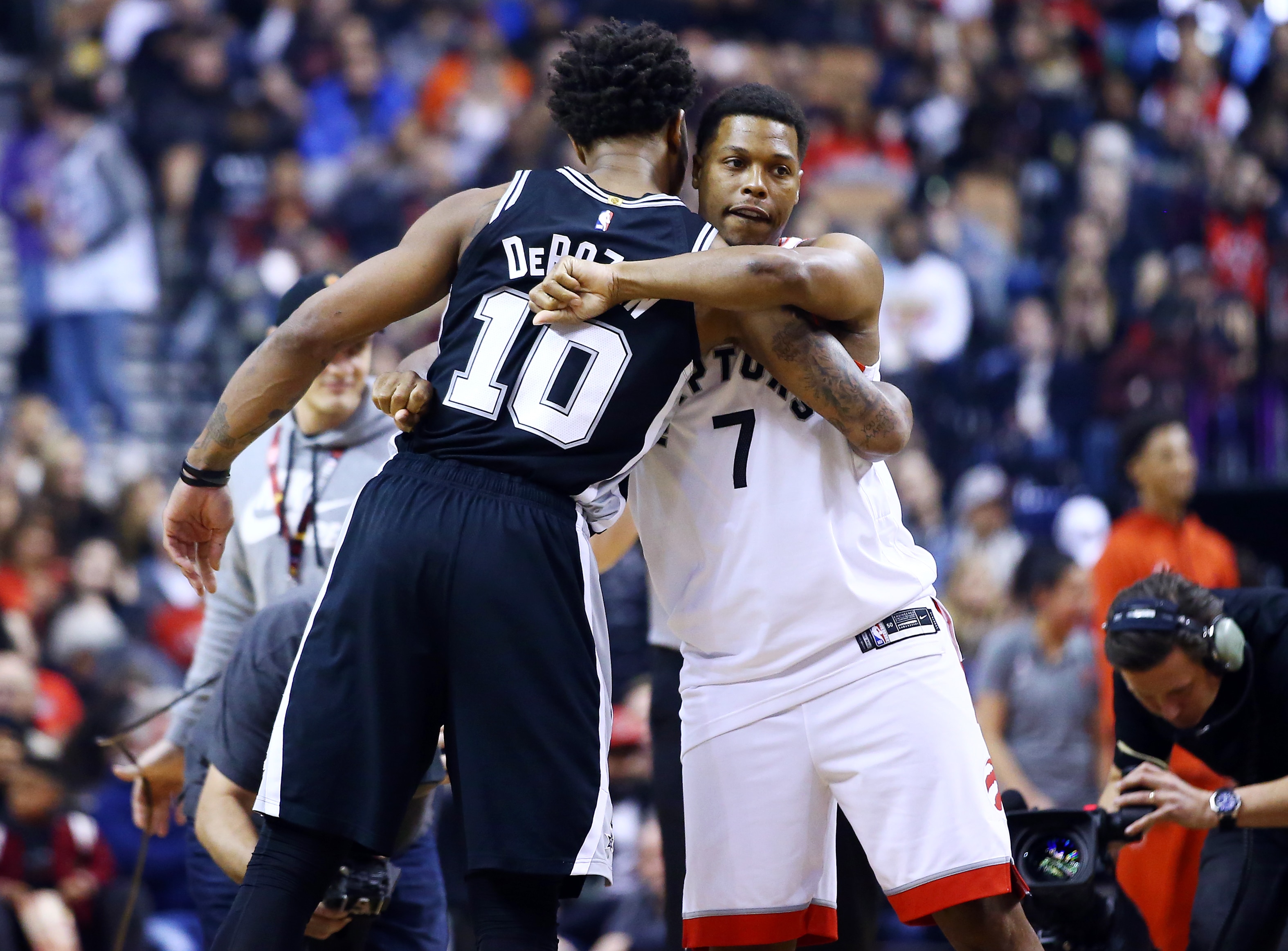 TORONTO, ON - JANUARY 12:  DeMar DeRozan #10 of the San Antonio Spurs hugs Kyle Lowry #7 of the Toronto Raptors prior to the first half of an NBA game at Scotiabank Arena on January 12, 2020 in Toronto, Canada.  NOTE TO USER: User expressly acknowledges and agrees that, by downloading and or using this photograph, User is consenting to the terms and conditions of the Getty Images License Agreement.  (Photo by Vaughn Ridley/Getty Images)