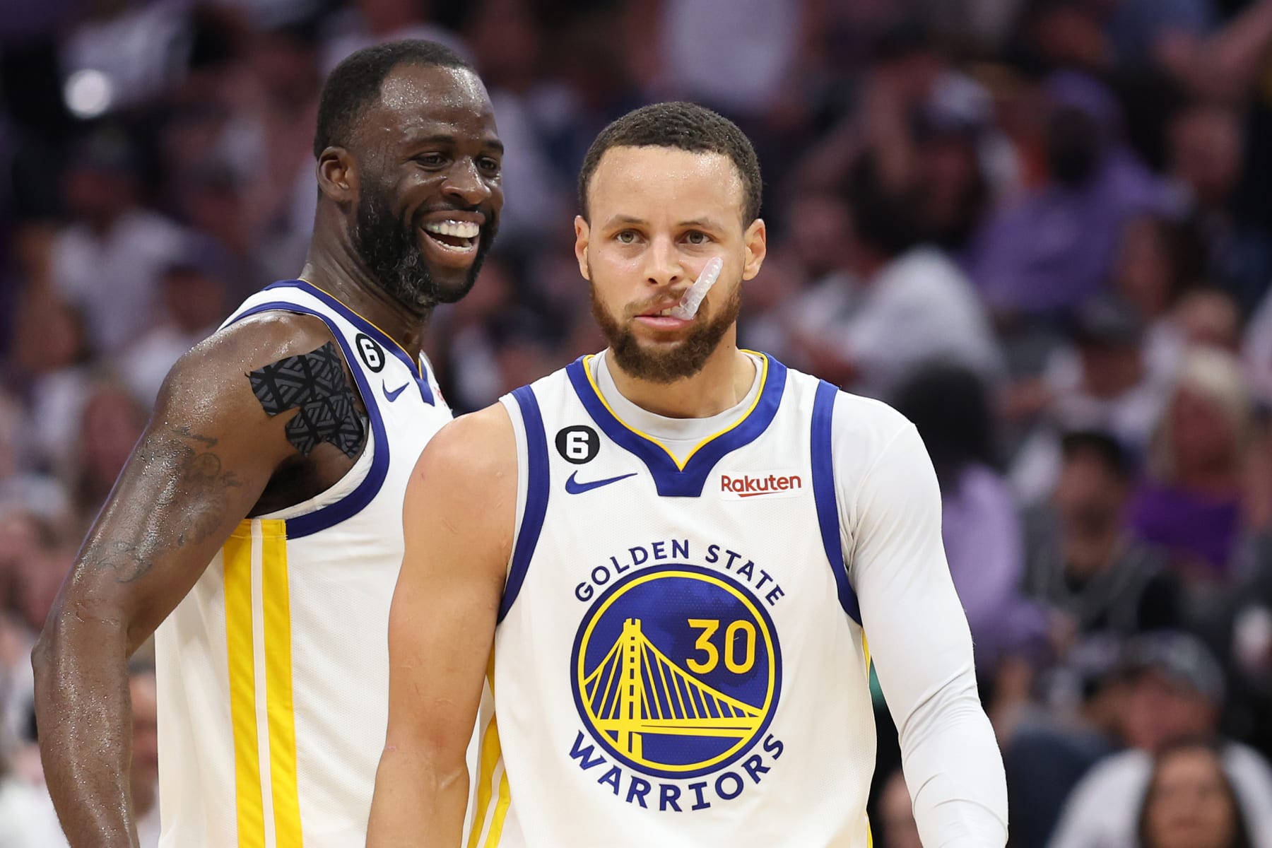 SACRAMENTO, CALIFORNIA - APRIL 30: Stephen Curry #30 of the Golden State Warriors and Draymond Green #23 react during the fourth quarter in game seven of the Western Conference First Round Playoffs against the Sacramento Kings at Golden 1 Center on April 30, 2023 in Sacramento, California. NOTE TO USER: User expressly acknowledges and agrees that, by downloading and or using this photograph, User is consenting to the terms and conditions of the Getty Images License Agreement. (Photo by Ezra Shaw/Getty Images)