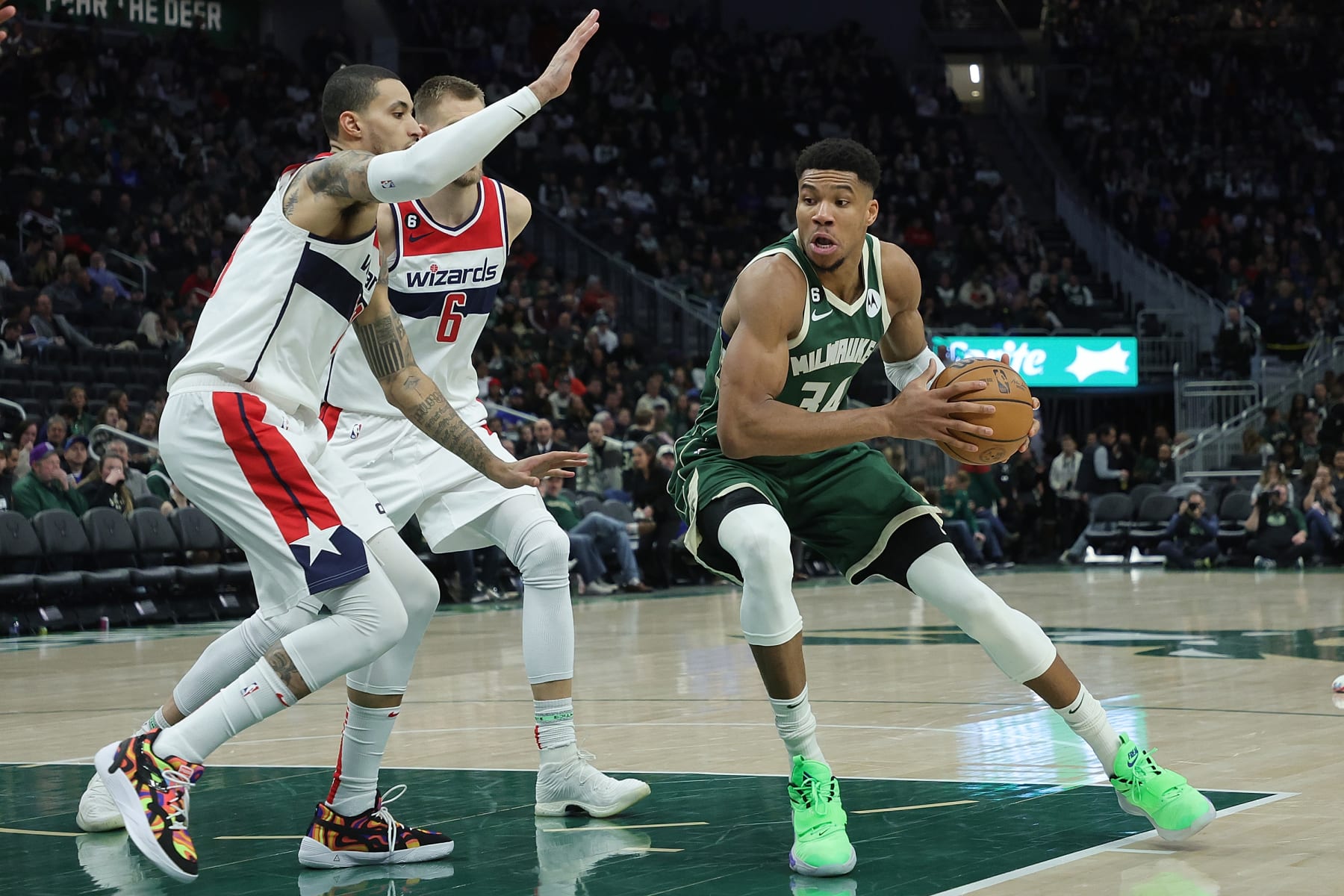 MILWAUKEE, WISCONSIN - JANUARY 03: Giannis Antetokounmpo #34 of the Milwaukee Bucks drives to the basket against Kyle Kuzma #33 of the Washington Wizards \dag at Fiserv Forum on January 03, 2023 in Milwaukee, Wisconsin. NOTE TO USER: User expressly acknowledges and agrees that, by downloading and or using this photograph, User is consenting to the terms and conditions of the Getty Images License Agreement. (Photo by Stacy Revere/Getty Images)