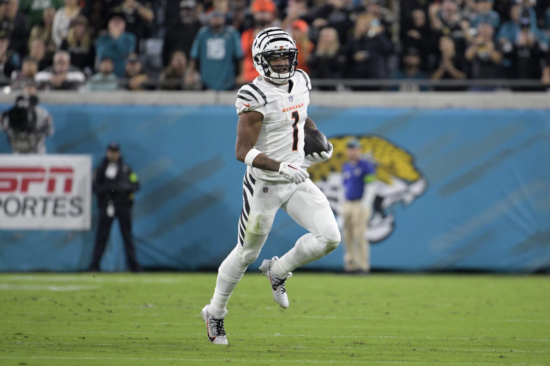 Cincinnati Bengals wide receiver Ja'Marr Chase (1) runs after catching a pass during the first half of an NFL football game against the Jacksonville Jaguars, Monday, Dec. 4, 2023, in Jacksonville, Fla. (AP Photo/Phelan M. Ebenhack)