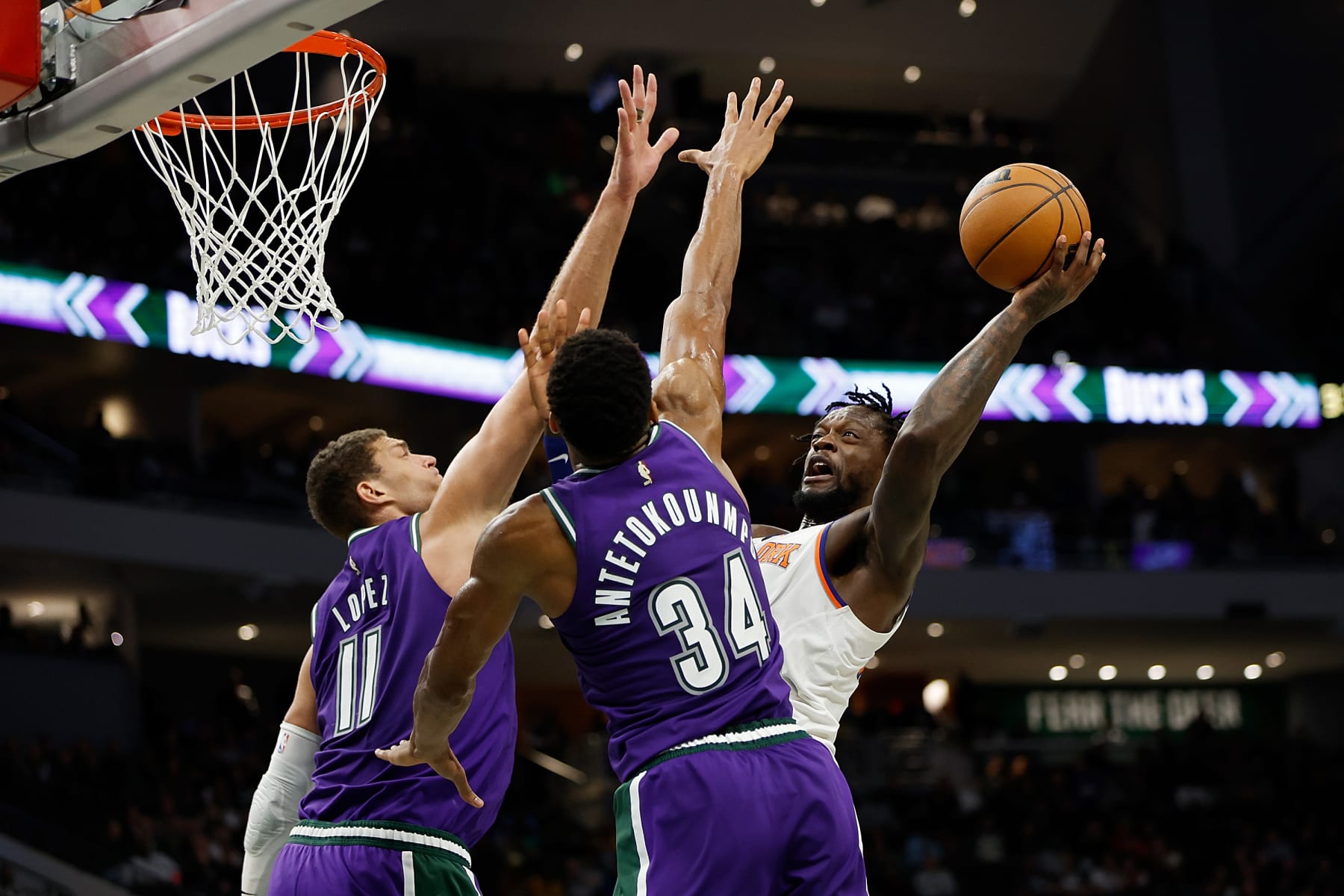 MILWAUKEE, WISCONSIN - OCTOBER 28: Julius Randle #30 of the New York Knicks goes up for a shot on Giannis Antetokounmpo #34 and Brook Lopez #11 of the Milwaukee Bucks during the second half of the game at Fiserv Forum on October 28, 2022 in Milwaukee, Wisconsin. NOTE TO USER: User expressly acknowledges and agrees that, by downloading and or using this photograph, User is consenting to the terms and conditions of the Getty Images License Agreement. (Photo by John Fisher/Getty Images)