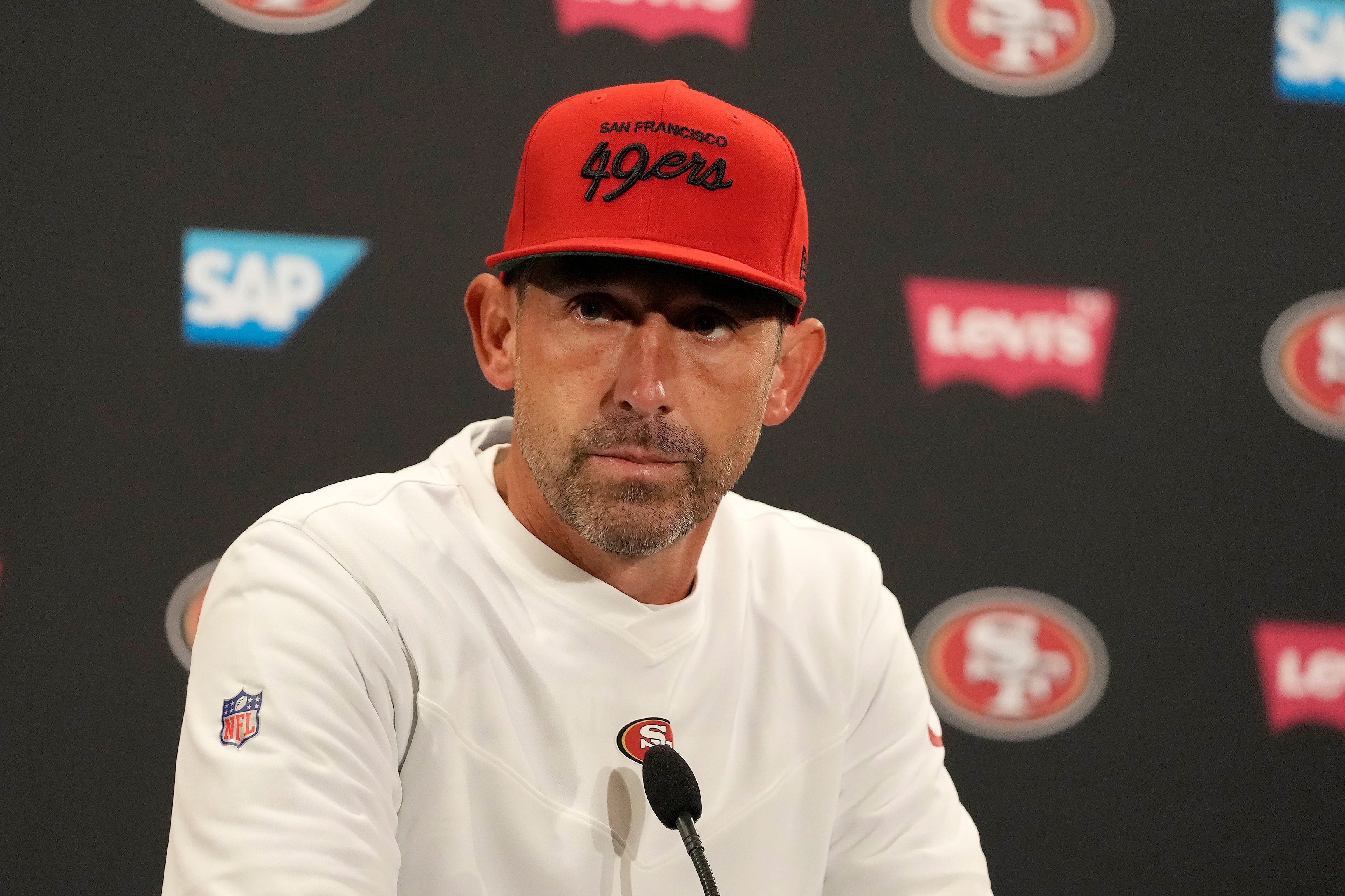 San Francisco 49ers head coach Kyle Shanahan speaks at a news conference after the Green Bay Packers defeated the 49ers in an NFL football game in Santa Clara, Calif., Sunday, Sept. 26, 2021. (AP Photo/Tony Avelar)