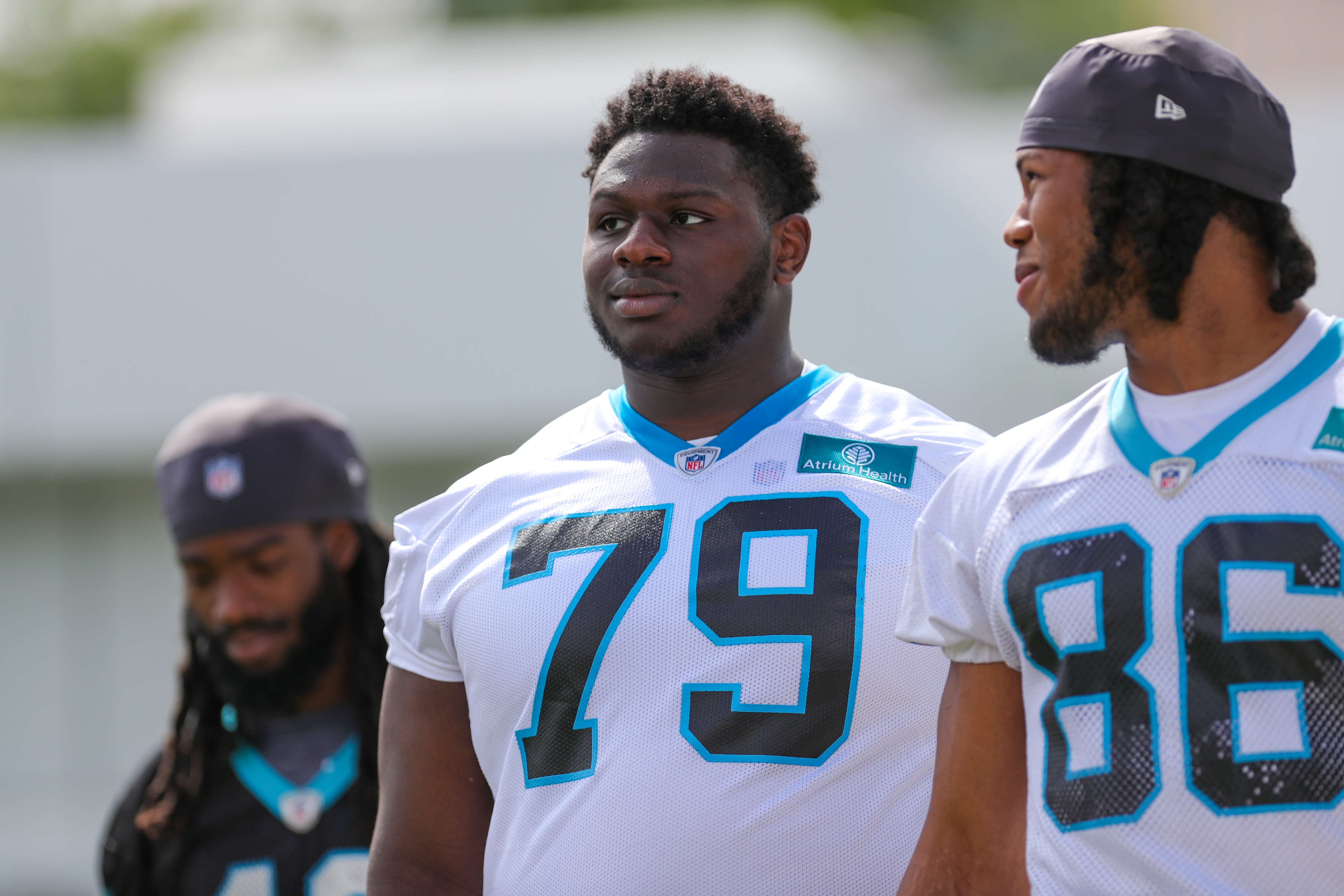 CHARLOTTE, NC - MAY 14: Carolina Panthers Rookie Tackle Ikem Ekwonu (79) and Rookie Tight End Jared Scott (86) walk to the field for day two of the Rookie Mini Camp on May 14, 2022 at the Carolina Panthers Practice Facility in Charlotte, NC (Photo by David Jensen/Icon Sportswire via Getty Images)