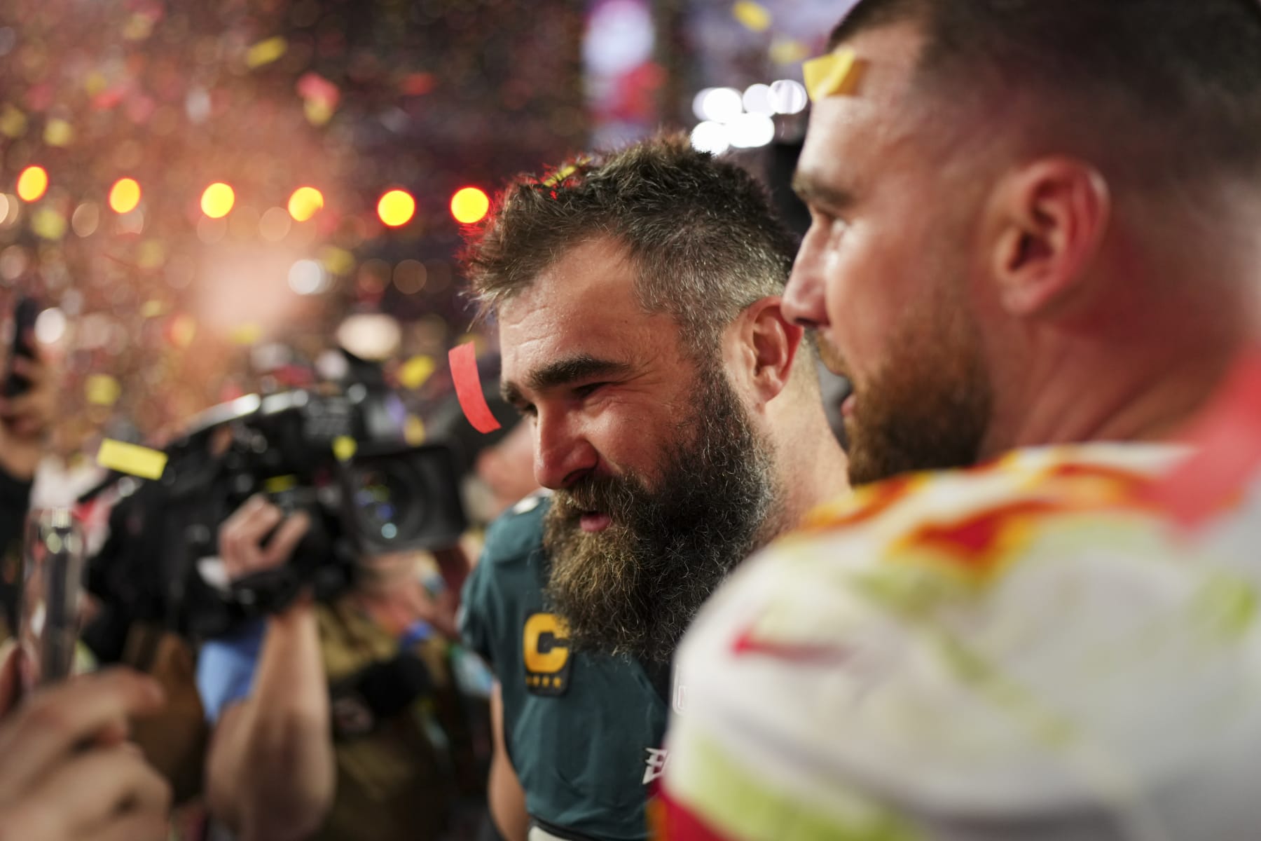 GLENDALE, AZ - FEBRUARY 12: Jason Kelce #62 of the Philadelphia Eagles speaks with Travis Kelce #87 of the Kansas City Chiefs after Super Bowl LVII at State Farm Stadium on February 12, 2023 in Glendale, Arizona. The Chiefs defeated the Eagles 38-35. (Photo by Cooper Neill/Getty Images)