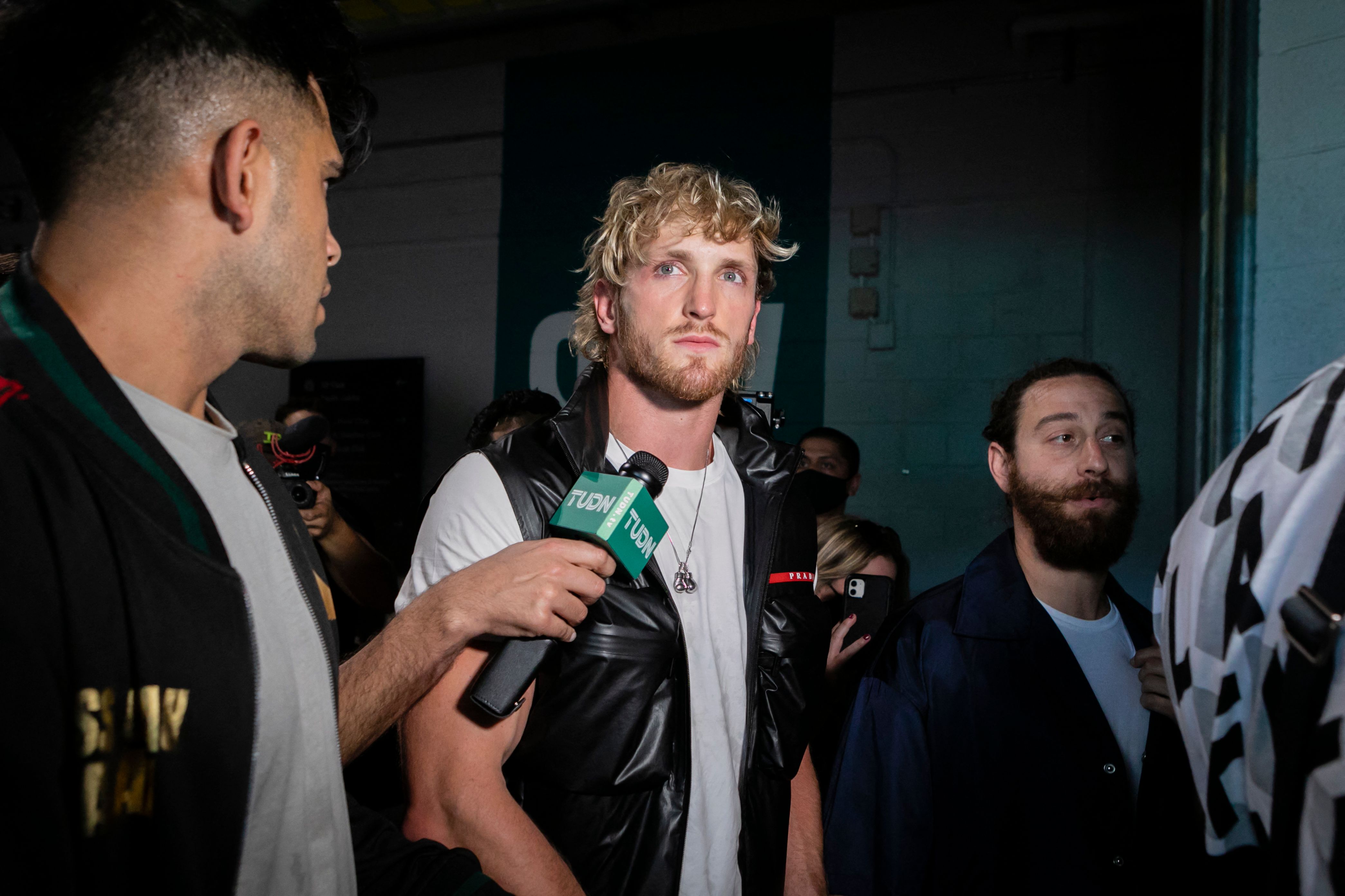 Logan The Maverick Paul talks to the media after his brother Jake Paul, took the cap of Floyd Money Mayweather, causing a clash during a press conference at Hard Rock Stadium, in Miami Gardens, Florida, on May 6, 2021. - Former world welterweight king Floyd Mayweather said May 4,2021 he will face off against YouTube personality Logan Paul in an exhibition bout at Miami's Hard Rock Stadium on June 6, 2021. (Photo by Eva Marie UZCATEGUI / AFP) (Photo by EVA MARIE UZCATEGUI/AFP via Getty Images)