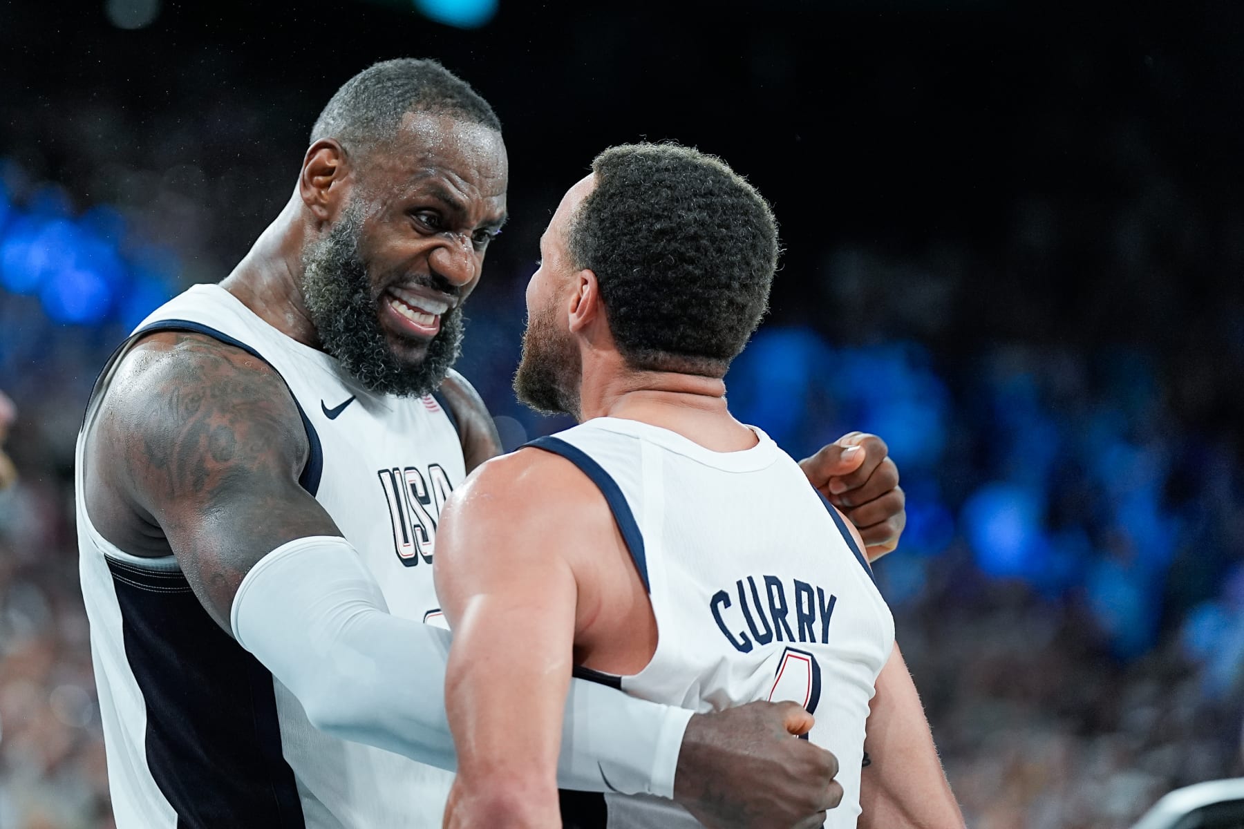 PARIS, FRANCE - AUGUST 8: Lebron James of United States and Stephen Curry of the United States celebrate their victory and entry into the Final during the Men's Semifinal Game between United States and Serbia on day thirteen of the Olympic Games Paris 2024 at Arena Bercy on August 8, 2024 in Paris, France. (Photo by Daniela Porcelli/Eurasia Sport Images/Getty Images)