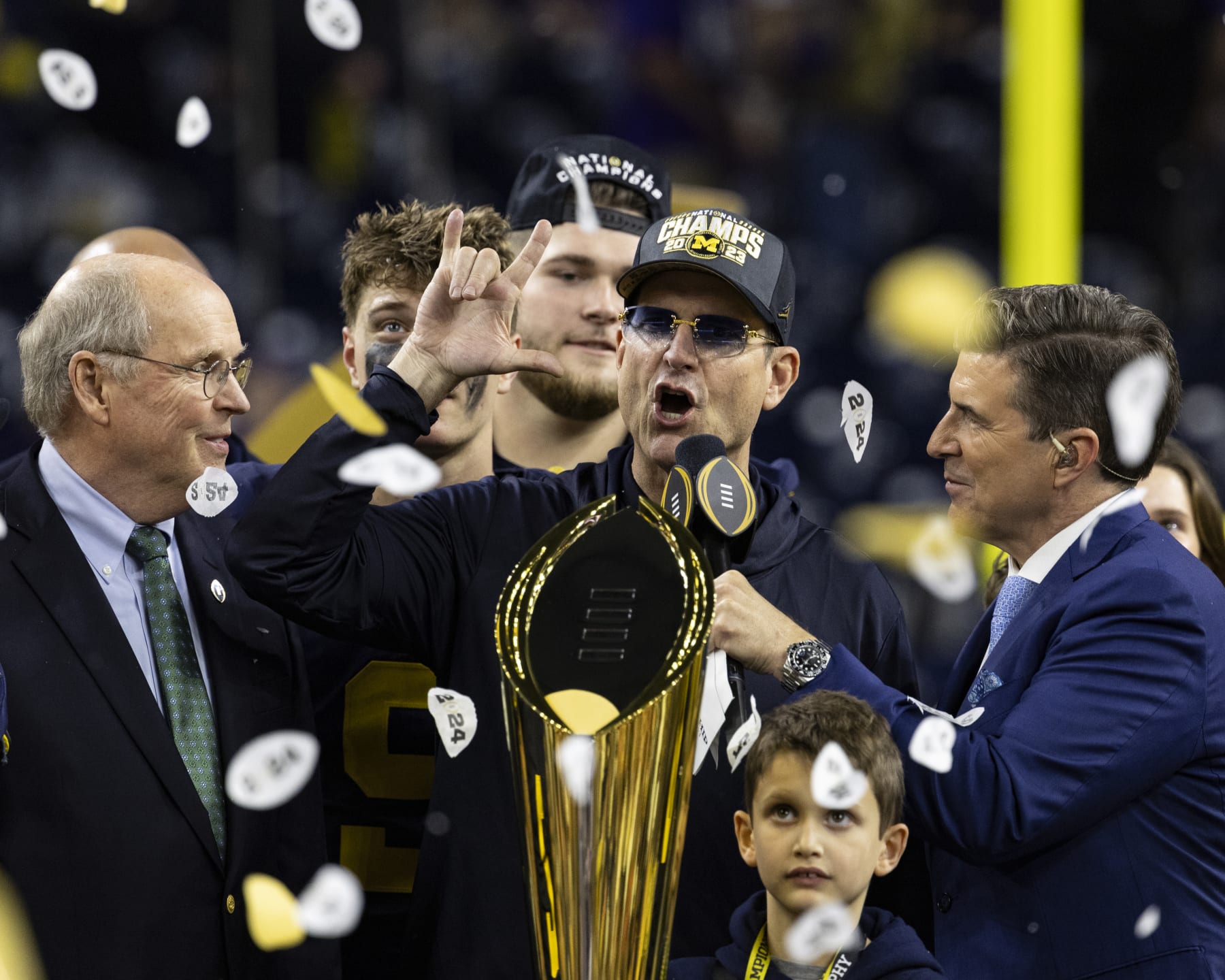 HOUSTON, TX - JANUARY 8: Head Coach Jim Harbaugh of the Michigan Wolverines is interviewed during the trophy presentation after the CFP National Championship game between University of Washington and University of Michigan at NRG Stadium on January 8, 2024 in Houston, Texas. (Photo by Steve Limentani/ISI Photos/Getty Images)