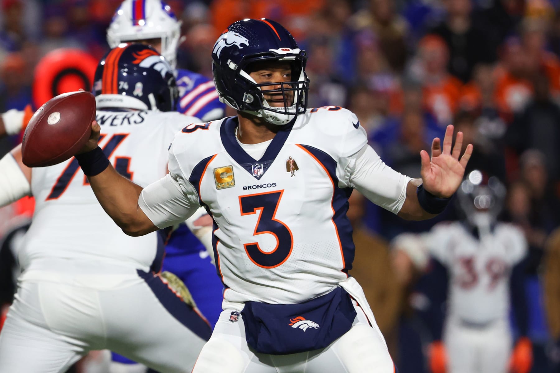 ORCHARD PARK, NEW YORK - NOVEMBER 13: Russell Wilson #3 of the Denver Broncos throws a pass against the Buffalo Bills during the first quarter of the game at Highmark Stadium on November 13, 2023 in Orchard Park, New York. (Photo by Timothy T Ludwig/Getty Images)