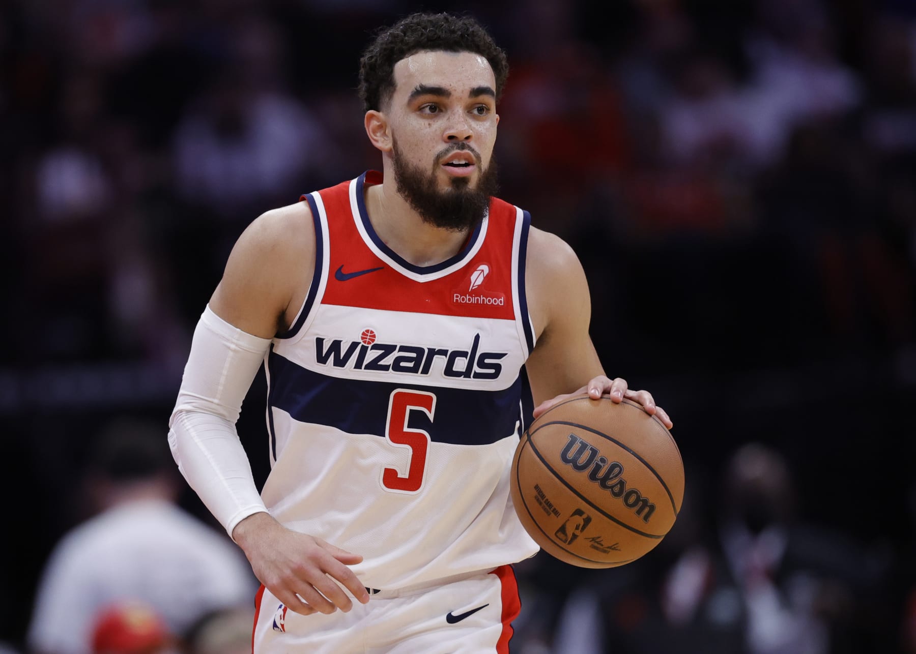 HOUSTON, TEXAS - MARCH 14: Tyus Jones #5 of the Washington Wizards in action against the Houston Rockets during the first half at Toyota Center on March 14, 2024 in Houston, Texas. NOTE TO USER: User expressly acknowledges and agrees that, by downloading and or using this photograph, User is consenting to the terms and conditions of the Getty Images License Agreement.  (Photo by Carmen Mandato/Getty Images)