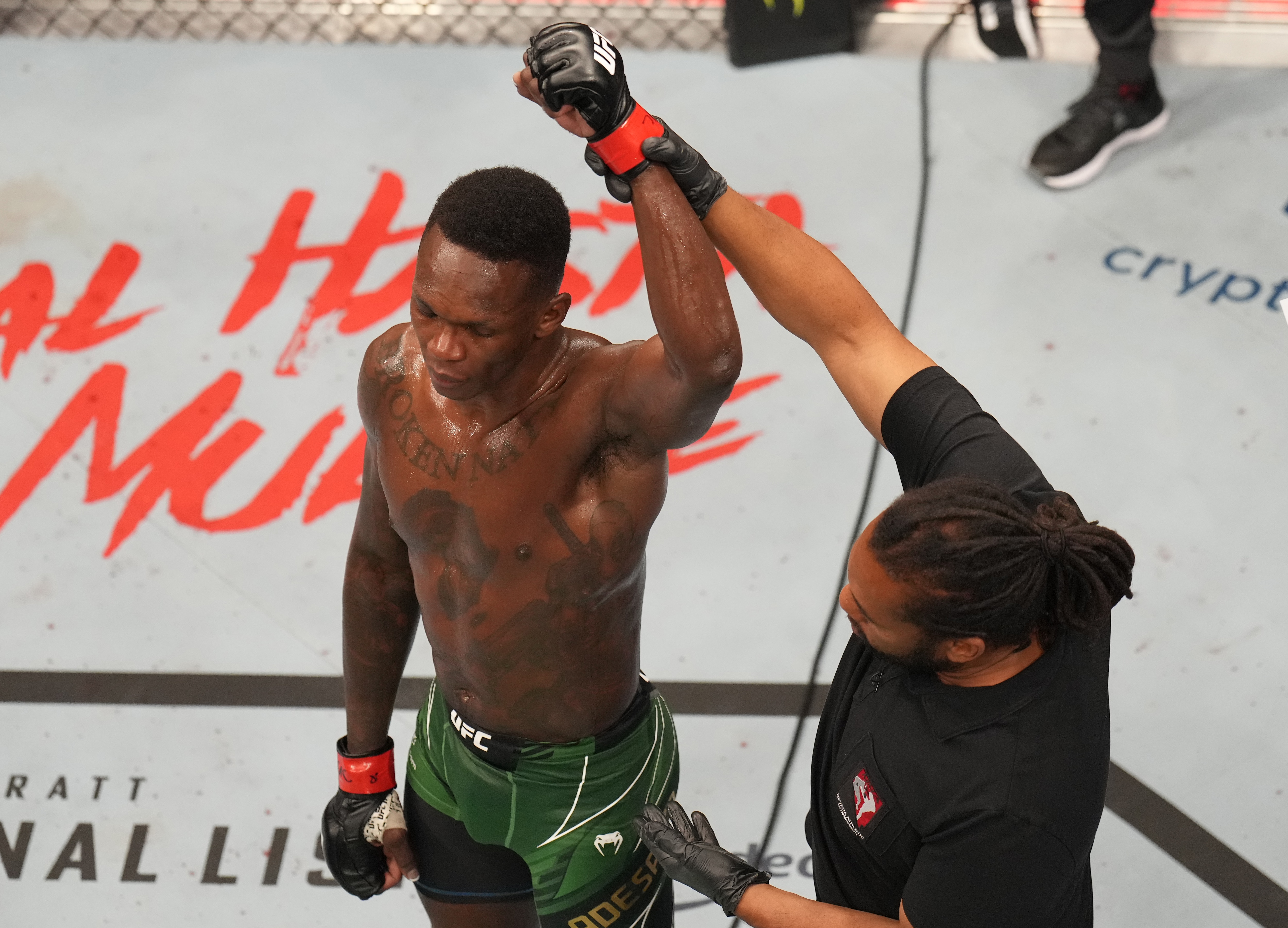 LAS VEGAS, NEVADA - JULY 02: Israel Adesanya of Nigeria reacts to his win over Jared Cannonier in the UFC middleweight championship fight during the UFC 276 event at T-Mobile Arena on July 02, 2022 in Las Vegas, Nevada. (Photo by Josh Hedges/Zuffa LLC)