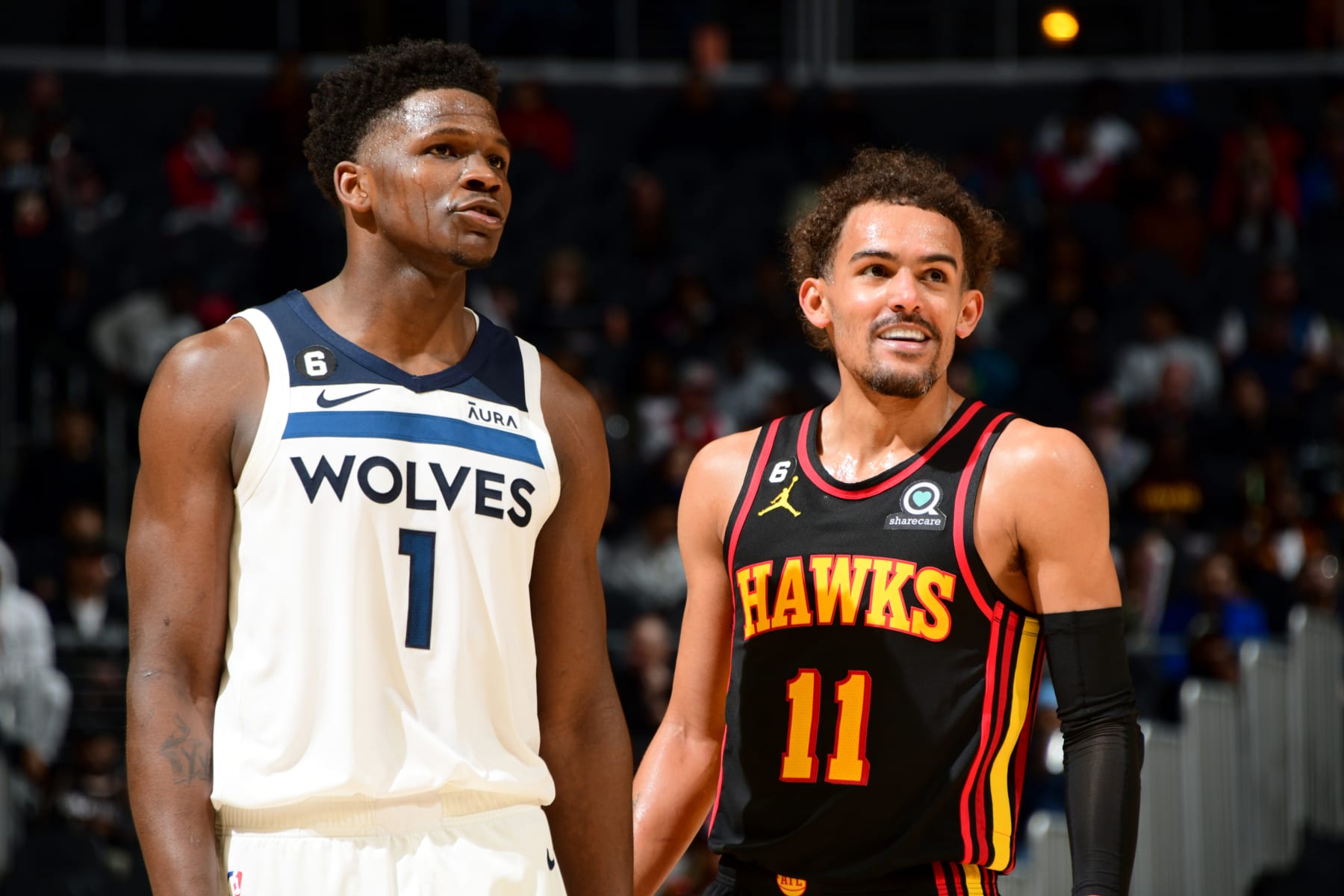 ATLANTA, GA - MARCH 13: Anthony Edwards #1 of the Minnesota Timberwolves and Trae Young #11 of the Atlanta Hawks look on during the game on March 13, 2023 at State Farm Arena in Atlanta, Georgia.  NOTE TO USER: User expressly acknowledges and agrees that, by downloading and/or using this Photograph, user is consenting to the terms and conditions of the Getty Images License Agreement. Mandatory Copyright Notice: Copyright 2023 NBAE (Photo by Scott Cunningham/NBAE via Getty Images)