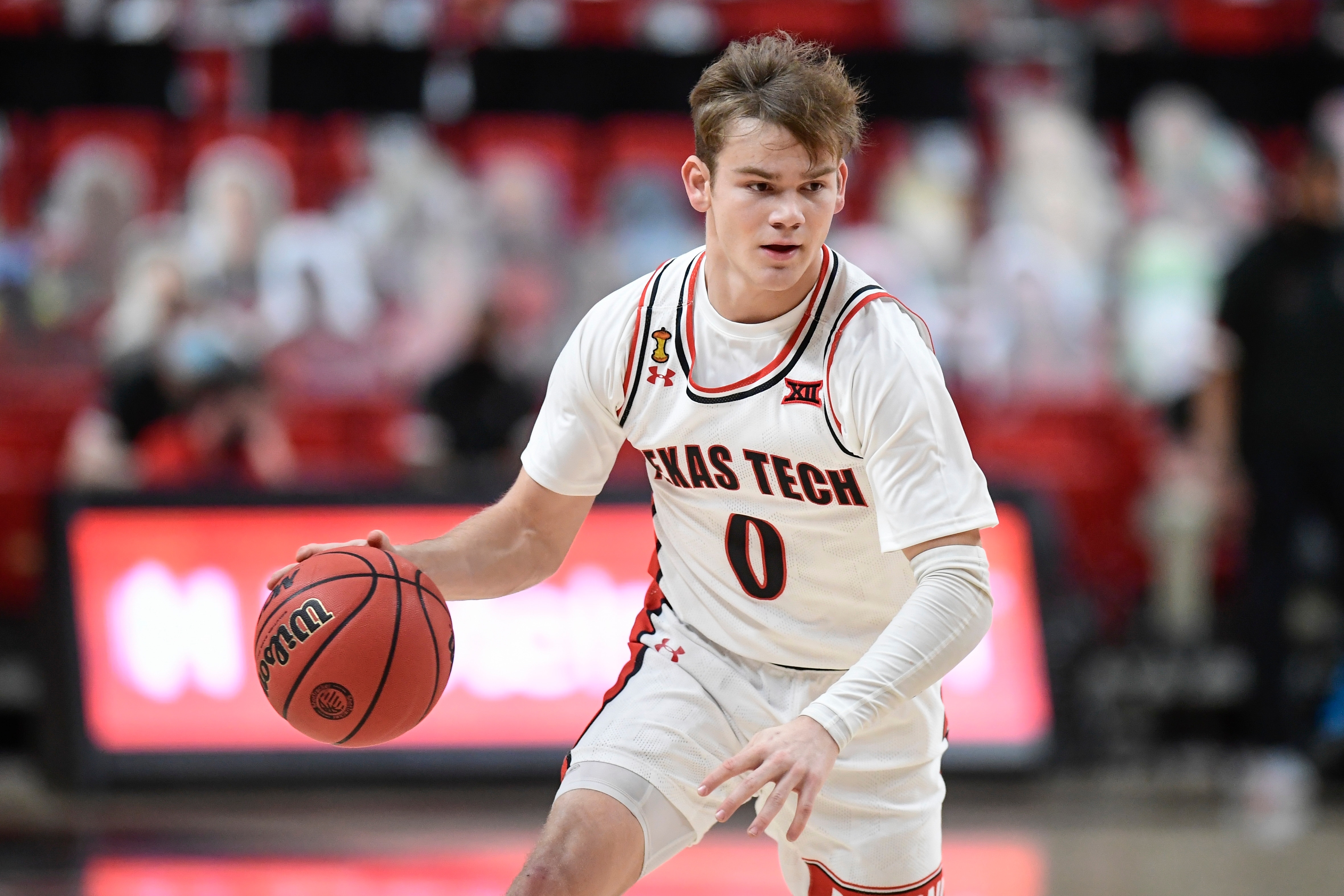 Texas Tech's Mac McClung (0) controls the ball during the first half of an NCAA college basketball game against Iowa State in Lubbock, Texas, Thursday, March 4, 2021. (AP Photo/Justin Rex)