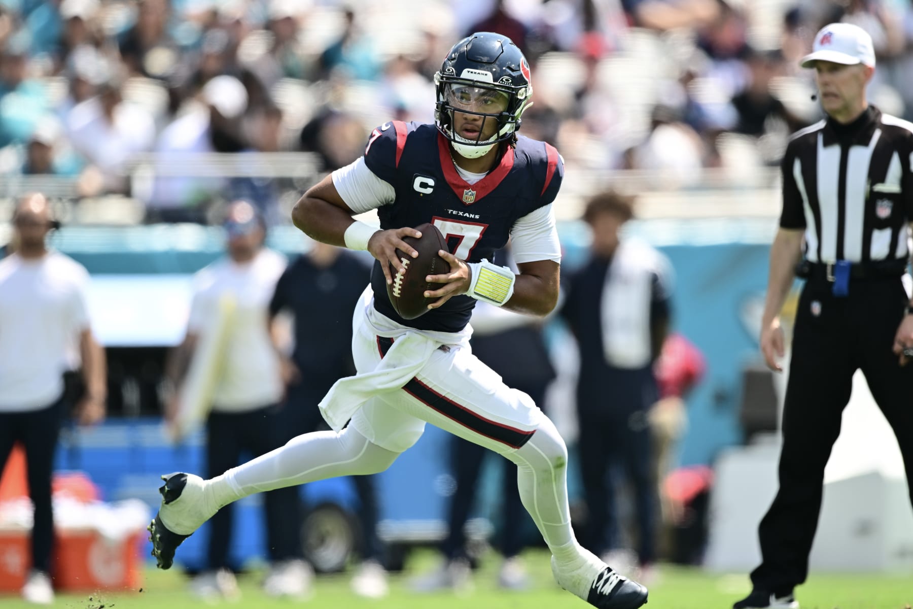 JACKSONVILLE, FLORIDA - SEPTEMBER 24: C.J. Stroud #7 of the Houston Texans runs with the ball during the second quarter of a game against the Jacksonville Jaguars at EverBank Stadium on September 24, 2023 in Jacksonville, Florida. (Photo by Julio Aguilar/Getty Images)