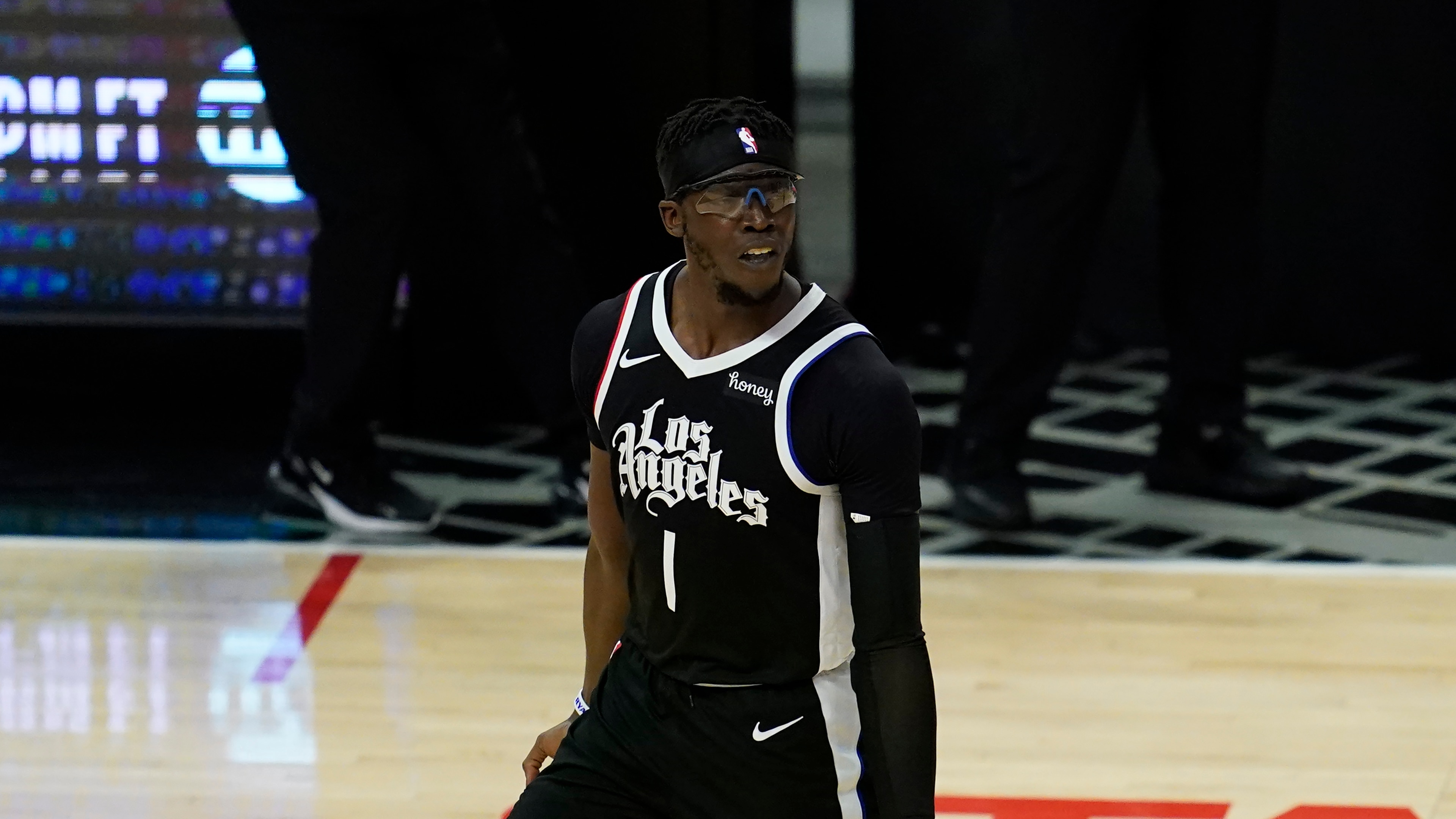 Los Angeles Clippers guard Reggie Jackson (1) reacts after scoring a three-pointer during Game 7 of an NBA basketball first-round playoff series against the Dallas Mavericks Sunday, June 6, 2021, in Los Angeles, Calif. (AP Photo/Ashley Landis)