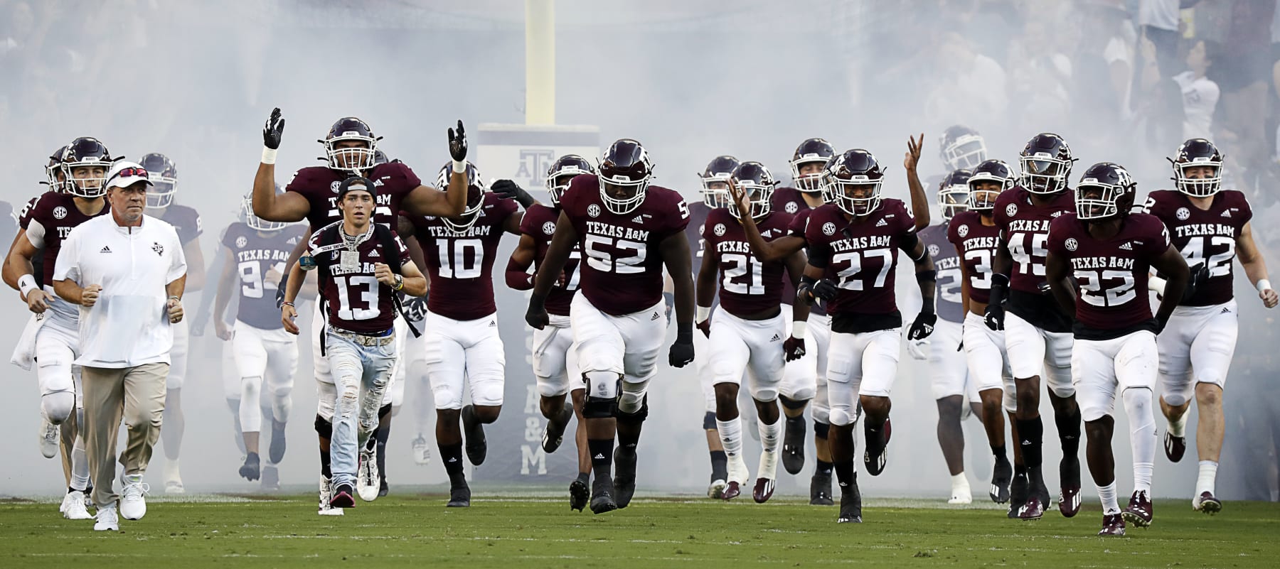 COLLEGE STATION, TEXAS - OCTOBER 02: head coach Jimbo Fisher of the Texas A&M Aggies brings his team onto the field against the Mississippi State Bulldogs at Kyle Field on October 02, 2021 in College Station, Texas. (Photo by Bob Levey/Getty Images) COLLEGE STATION, TEXAS - OCTOBER 02: head coach Jimbo Fisher of the Texas A&M Aggies brings his team onto the field against the Mississippi State Bulldogs at Kyle Field on October 02, 2021 in College Station, Texas. (Photo by Bob Levey/Getty Images)