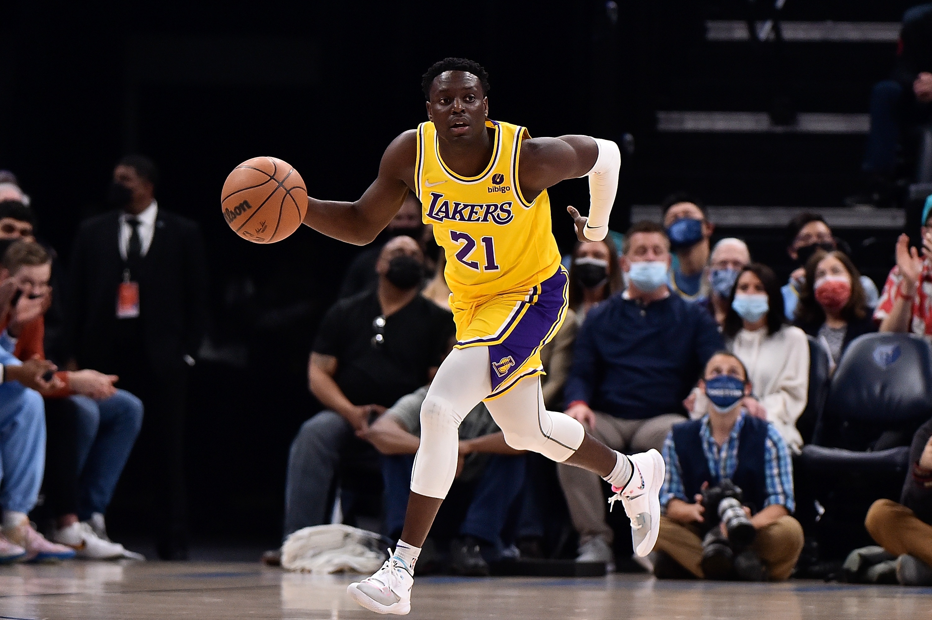 MEMPHIS, TENNESSEE - DECEMBER 29: Los Angeles Lakers guard Darren Collison #21 brings the ball up court during the game against the Memphis Grizzlies at FedExForum on December 29, 2021 in Memphis, Tennessee. NOTE TO USER: User expressly acknowledges and agrees that, by downloading and or using this photograph, User is consenting to the terms and conditions of the Getty Images License Agreement.  (Photo by Justin Ford/Getty Images)