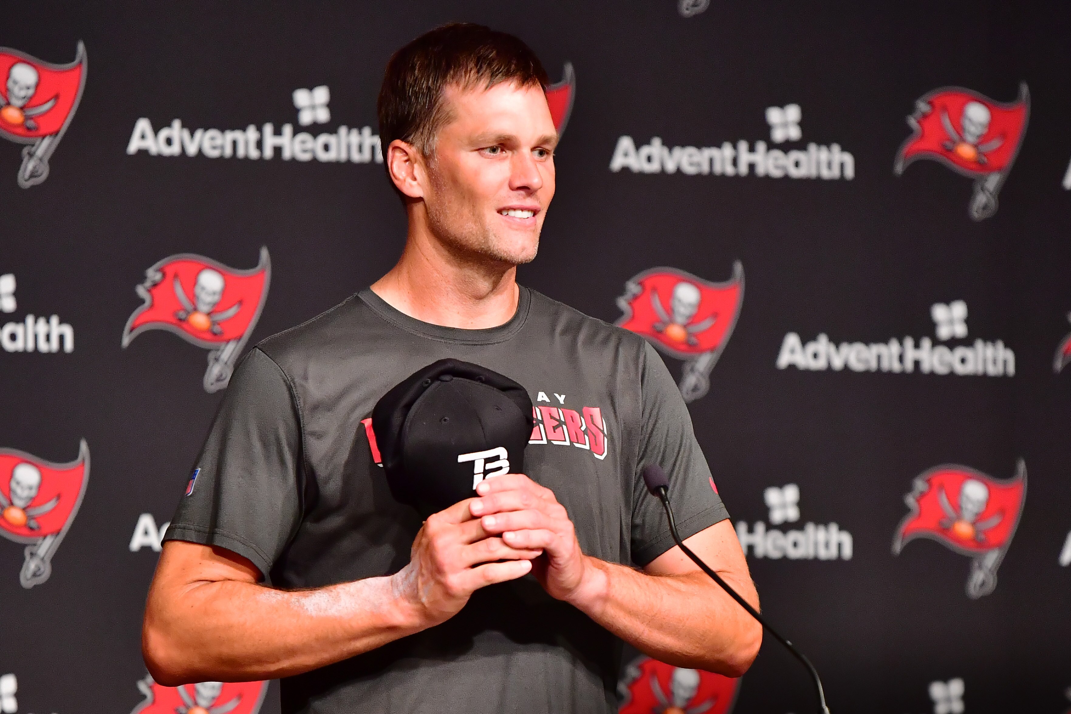 TAMPA, FLORIDA - JUNE 09: Tom Brady #12 of Tampa Bay Buccaneers answers questions at a press conference following the 2022 Buccaneers minicamp at AdventHealth Training Center on June 09, 2022 in Tampa, Florida. (Photo by Julio Aguilar/Getty Images)