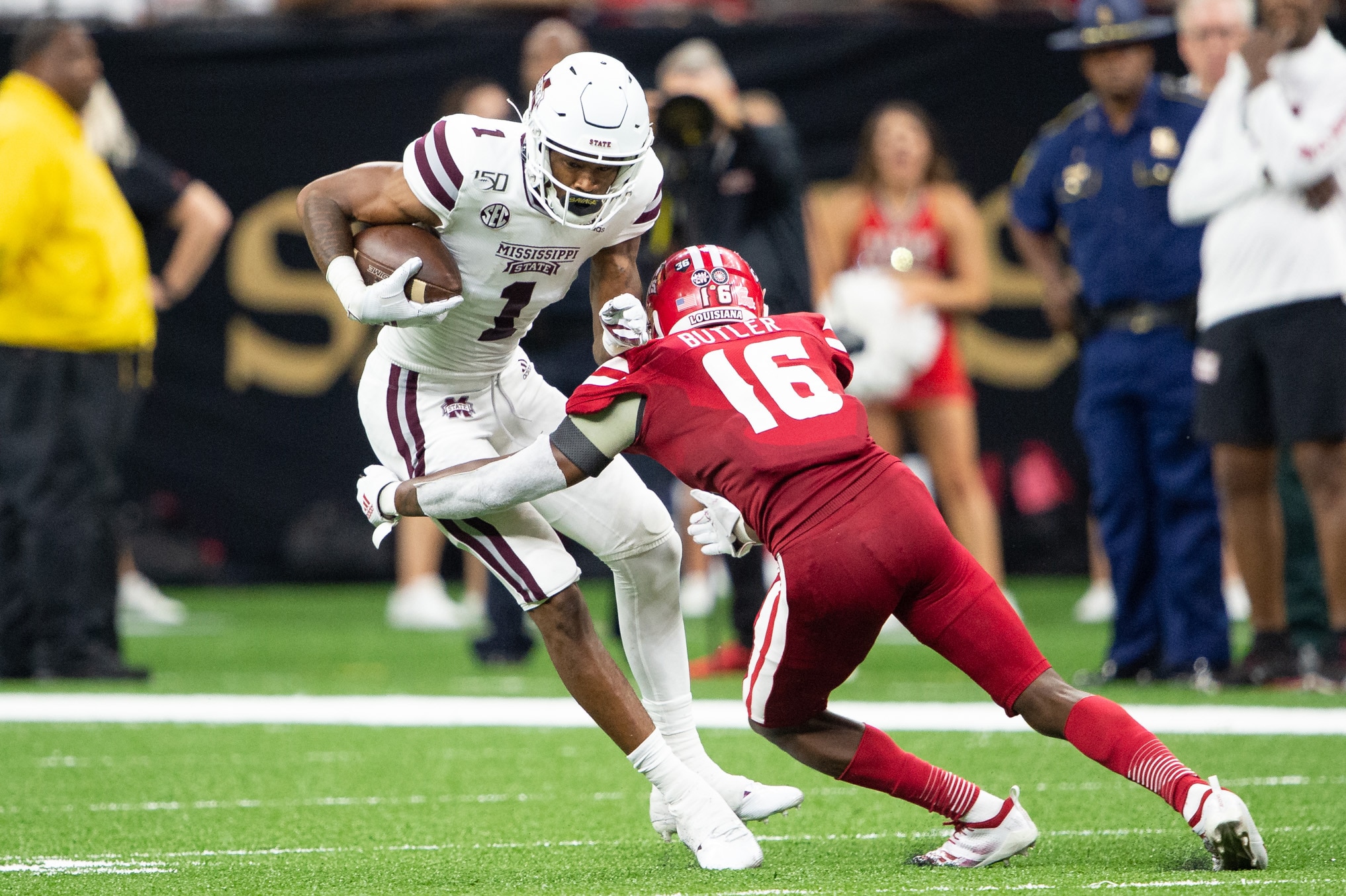 NEW ORLEANS, LA - AUGUST 31: Wide receiver Stephen Guidry #1 of the Mississippi State Bulldogs attempts to escape a tackle by defensive back Percy Butler #16 of the Louisiana-Lafayette Ragin Cajuns during the fourth quarter at Mercedes Benz Superdome on August 31, 2019 in New Orleans, Louisiana. (Photo by Michael Chang/Getty Images)