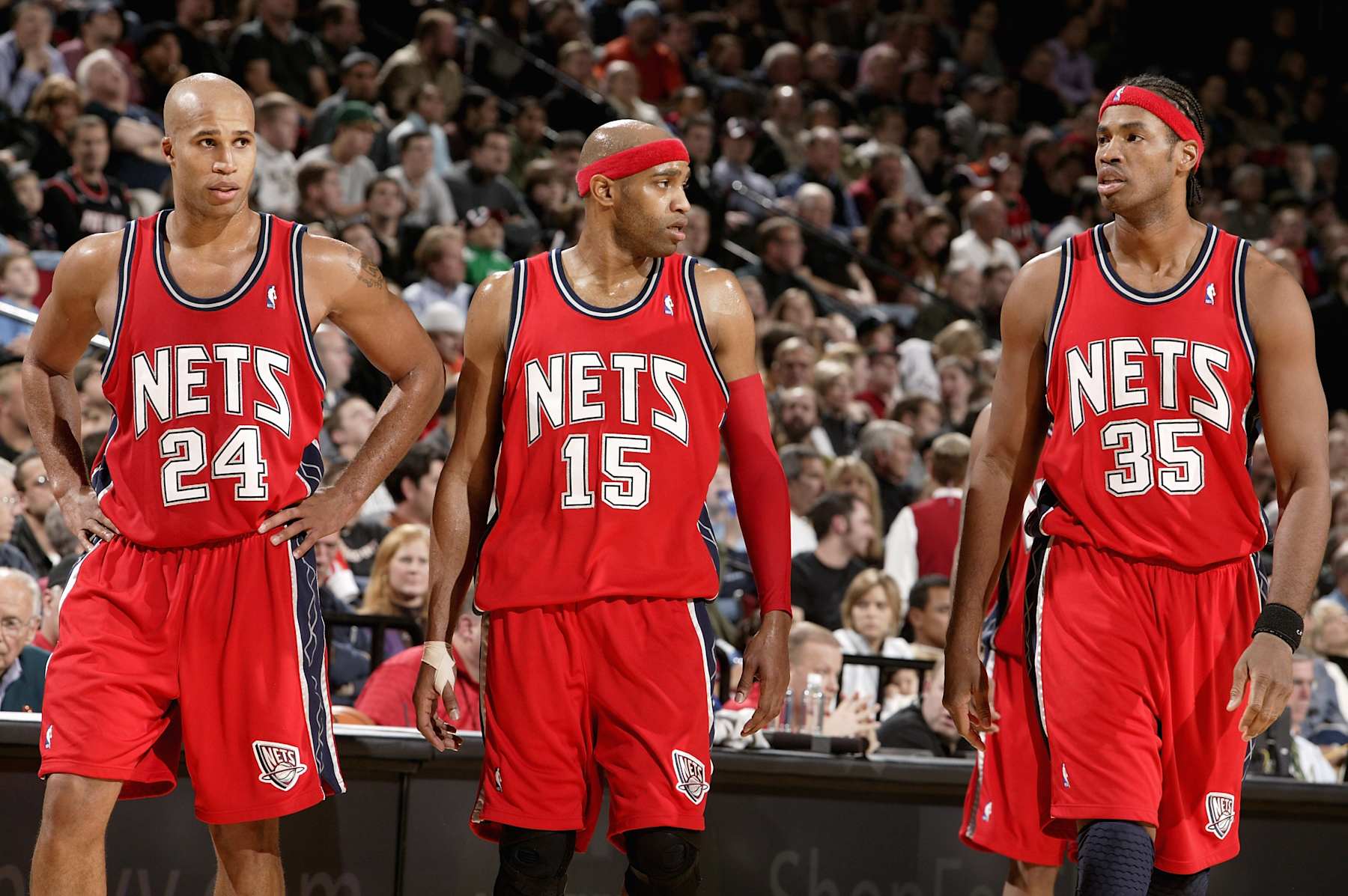 PORTLAND, OR - NOVEMBER 21:  (L-R) Richard Jefferson #24, Vince Carter #15 and Jason Collins #35 of the New Jersey Nets walk across the court during the game against the Portland Trail Blazers on November 21, 2007 at the Rose Garden in Portland, Oregon.  The Nets won 106-101.  NOTE TO USER: User expressly acknowledges and agrees that, by downloading and/or using this Photograph, user is consenting to the terms and conditions of the Getty Images License Agreement. Mandatory Copyright Notice: Copyright 2007 NBAE   (Photo by Sam Forencich/NBAE via Getty Images)