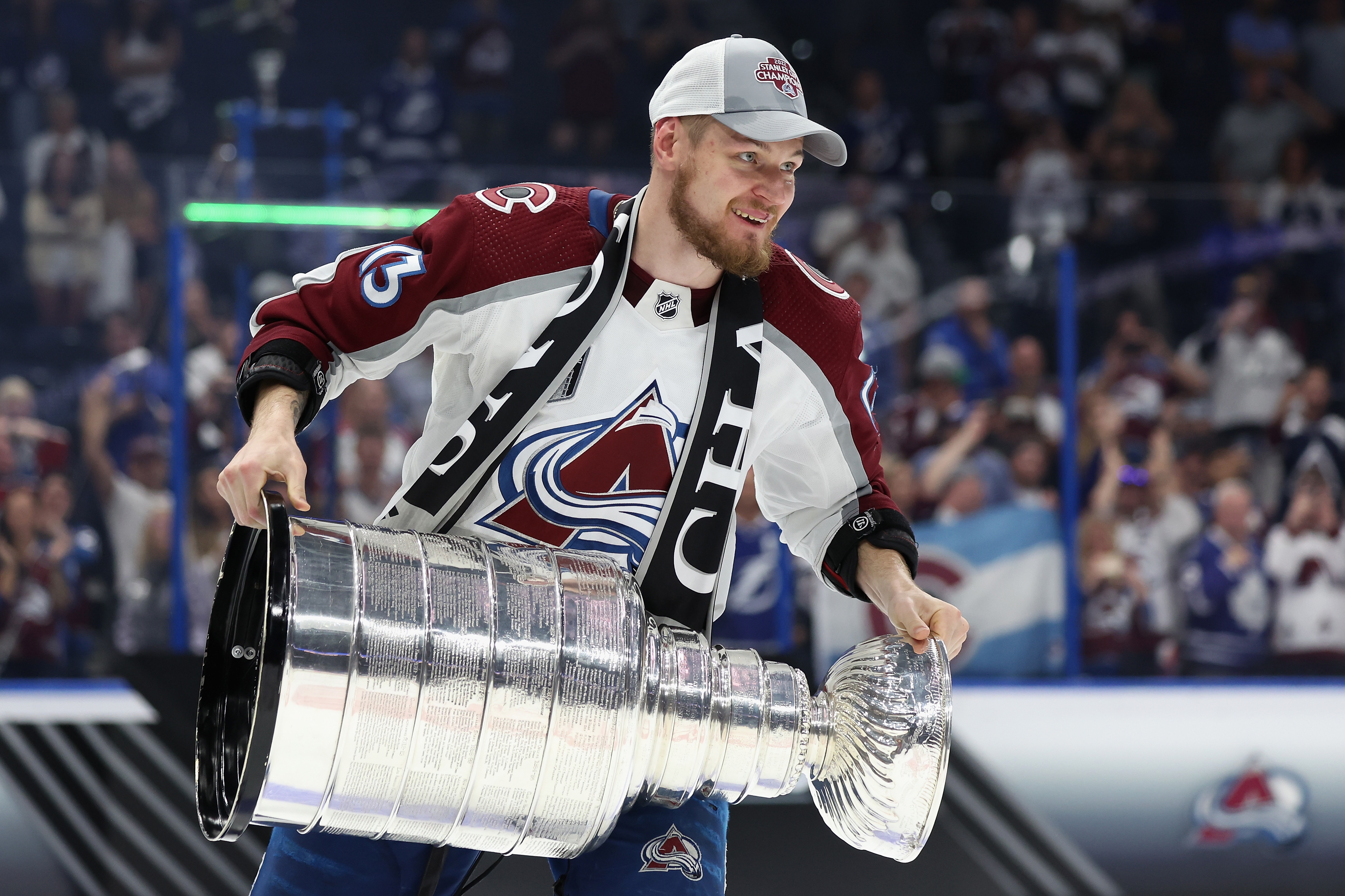 TAMPA, FLORIDA - JUNE 26:  Valeri Nichushkin #13 of the Colorado Avalanche lifts the Stanley Cup in celebration after Game Six of the 2022 NHL Stanley Cup Final at Amalie Arena on June 26, 2022 in Tampa, Florida. The Avalanche defeated the Lightning 2-1.  (Photo by Christian Petersen/Getty Images)