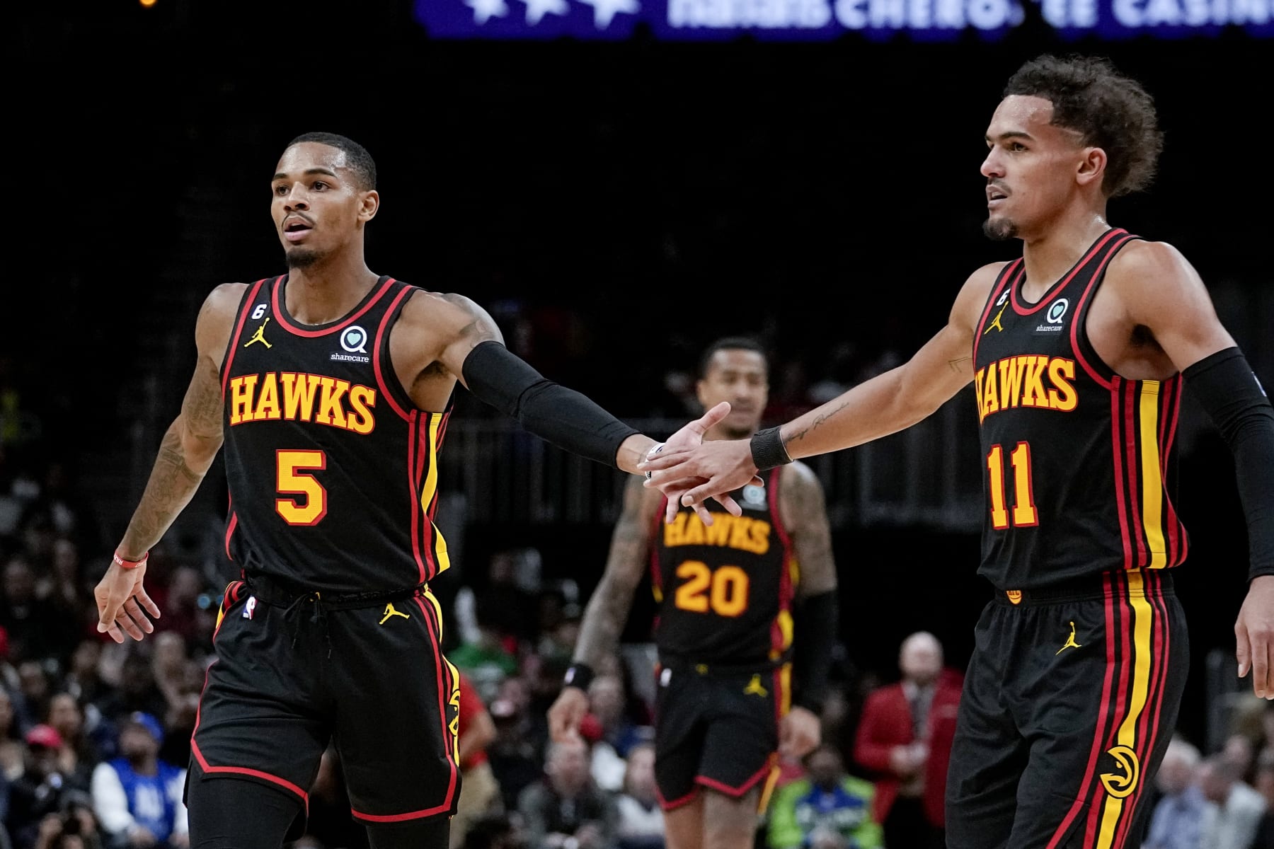 Atlanta Hawks guard Dejounte Murray (5) and Atlanta Hawks guard Trae Young (11) are shown during the second half of an NBA basketball game against the Boston Celtics Wednesday, Nov. 16, 2022 in Atlanta. (AP Photo/John Bazemore)