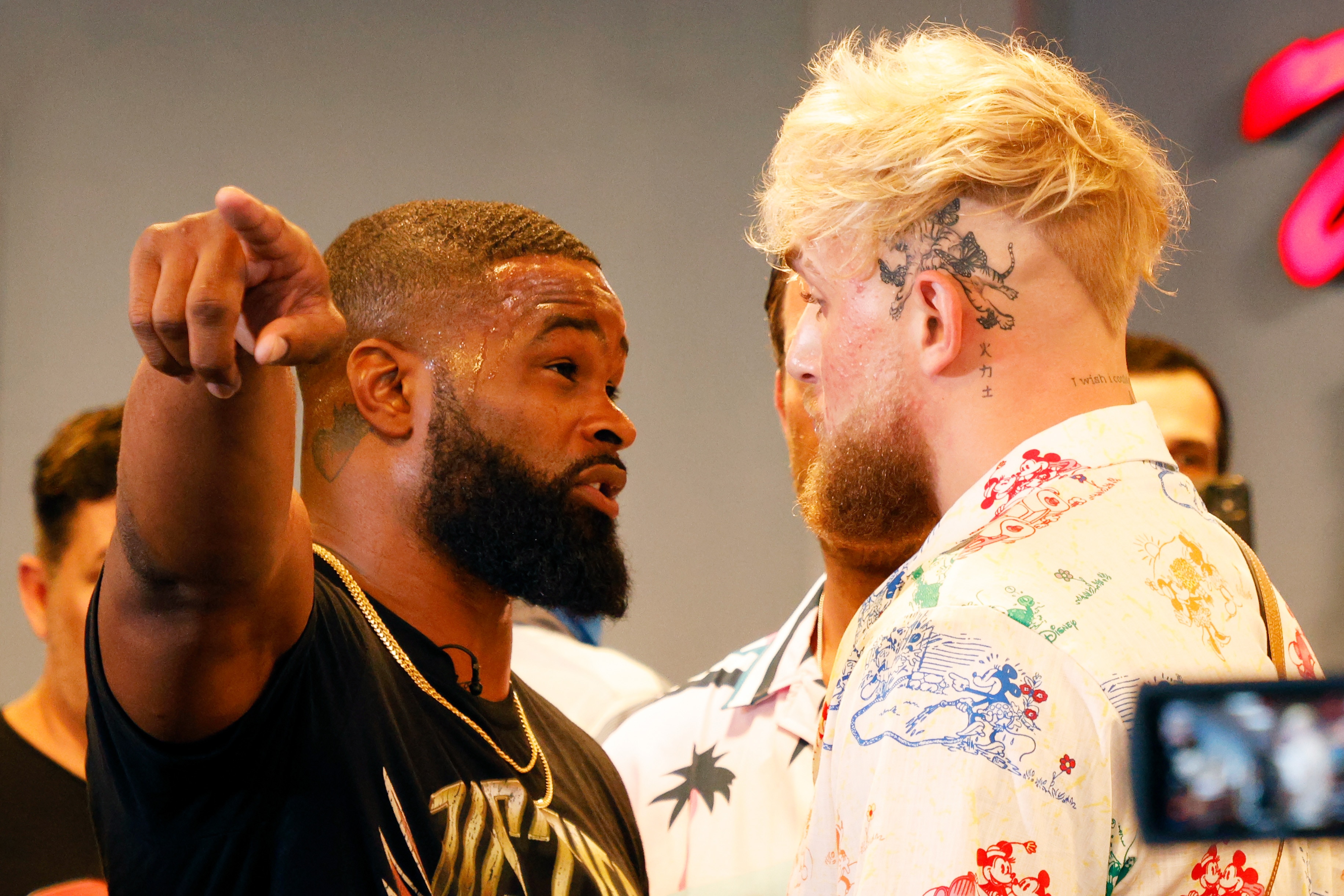 MIAMI, FLORIDA - JUNE 03: Jake Paul and Tyron Woodley take part in media availability at 5th St. Gym ahead of their August 28th boxing match on June 03, 2021 in Miami, Florida. (Photo by Cliff Hawkins/Getty Images)