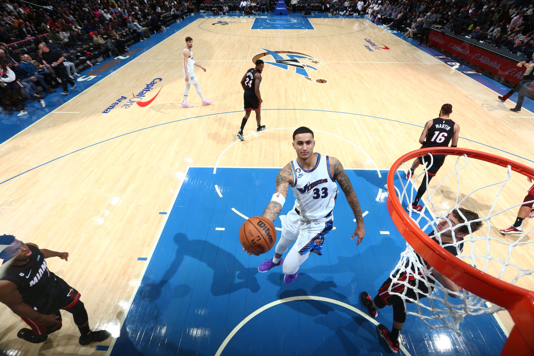 WASHINGTON, DC -  NOVEMBER 18: Kyle Kuzma #33 of the Washington Wizards drives to the basket during the game against the Miami Heat on November 18, 2022 at Capital One Arena in Washington, DC. NOTE TO USER: User expressly acknowledges and agrees that, by downloading and or using this Photograph, user is consenting to the terms and conditions of the Getty Images License Agreement. Mandatory Copyright Notice: Copyright 2022 NBAE (Photo by Stephen Gosling/NBAE via Getty Images)