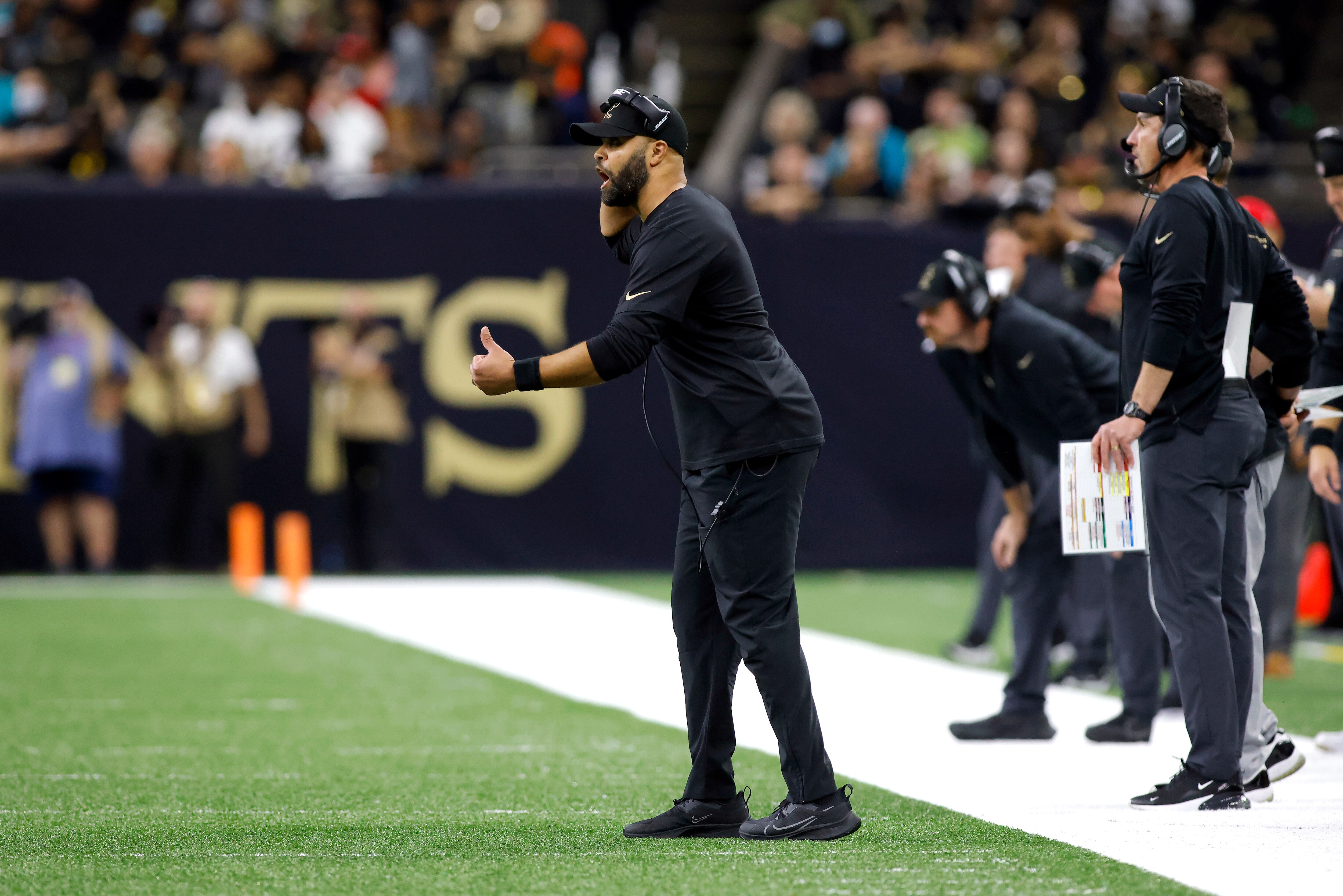 New Orleans Saints secondary coach Kris Richard reacts to a call during an NFL football game against the Miami Dolphins, Monday, Dec. 27, 2021, in New Orleans. (AP Photo/Tyler Kaufman)