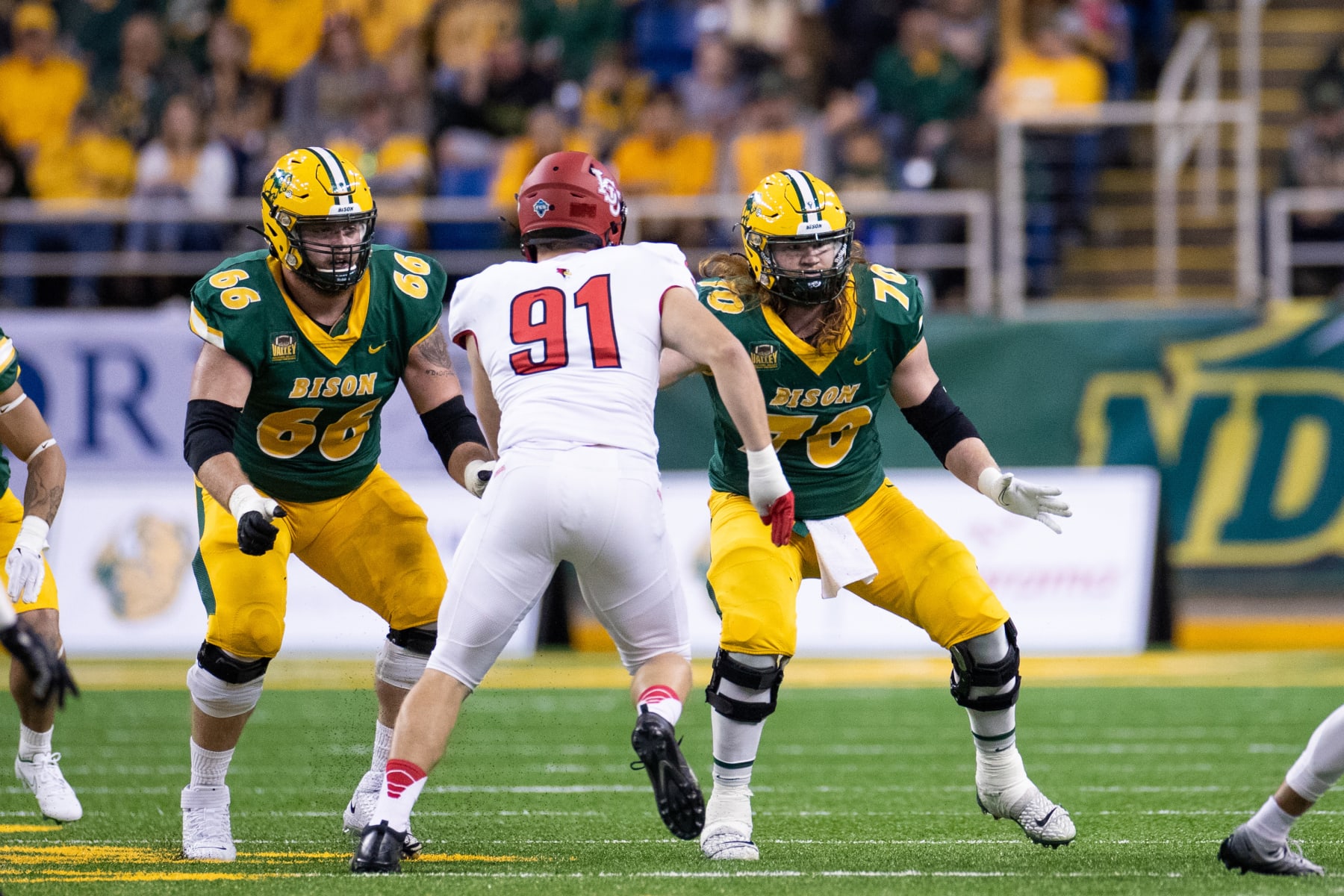 FARGO, NORTH DAKOTA - OCTOBER 29: Nash Jensen #66 and Cody Mauch #70 of the North Dakota State Bison lines up against the Illinois State Redbirds at FARGODOME on October 29, 2022 in Fargo, North Dakota. (Photo by Sean Arbaut/Getty Images)