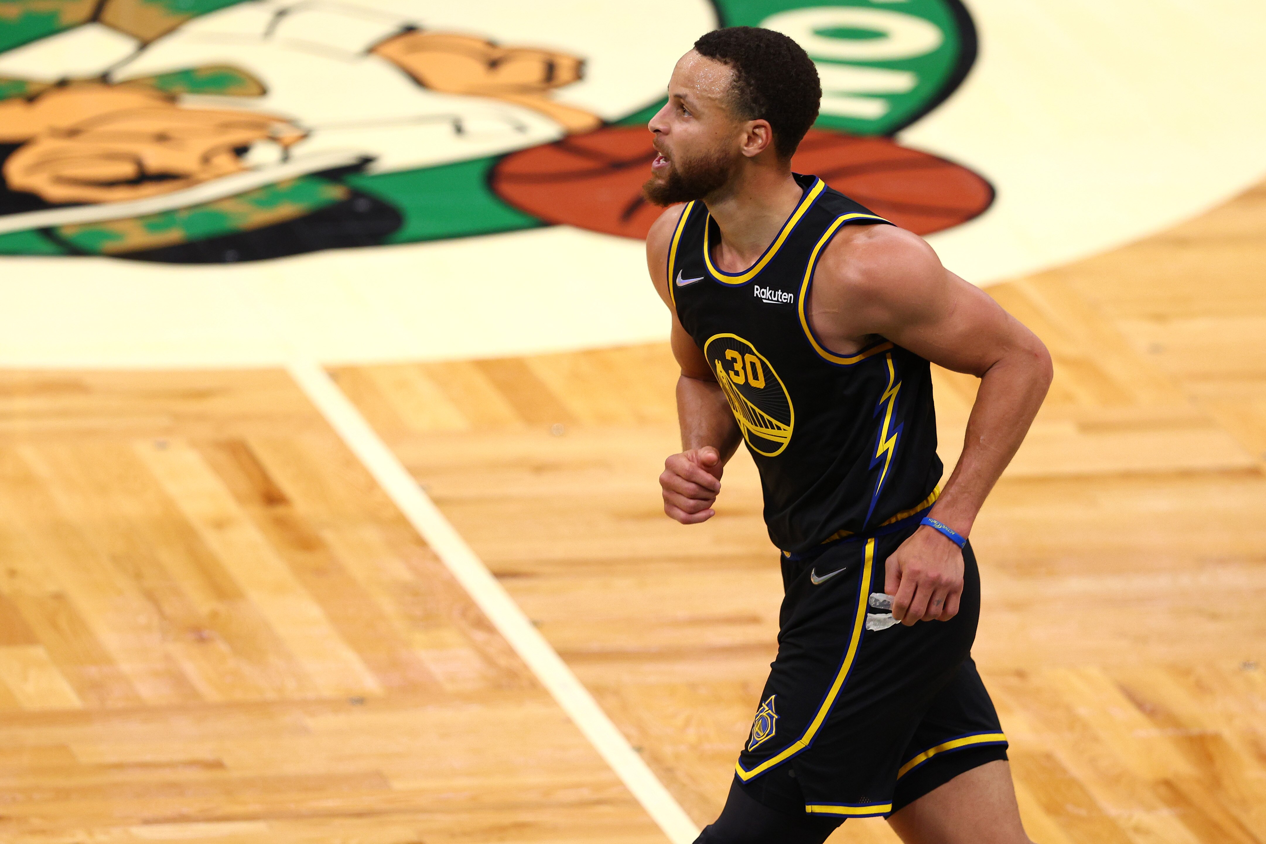 BOSTON, MASSACHUSETTS - JUNE 10: Stephen Curry #30 of the Golden State Warriors celebrates a basket in the fourth quarter against the Boston Celtics during Game Four of the 2022 NBA Finals at TD Garden on June 10, 2022 in Boston, Massachusetts. NOTE TO USER: User expressly acknowledges and agrees that, by downloading and/or using this photograph, User is consenting to the terms and conditions of the Getty Images License Agreement. (Photo by Elsa/Getty Images)