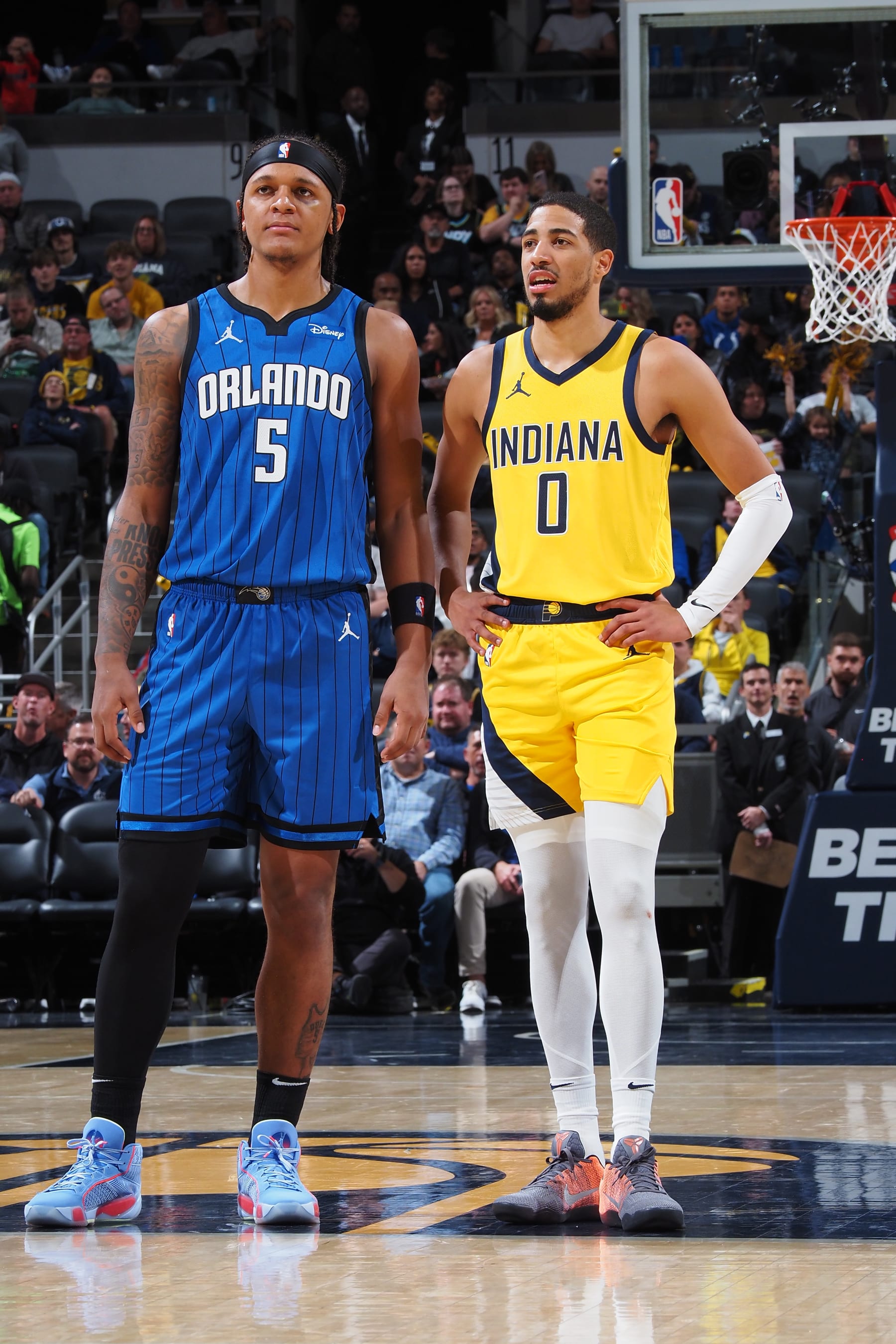 INDIANAPOLIS, IN - NOVEMBER 19: Paolo Banchero #5 of the Orlando Magic and Tyrese Haliburton #0 of the Indiana Pacers look on during the game on November 19, 2023 at Gainbridge Fieldhouse in Indianapolis, Indiana. NOTE TO USER: User expressly acknowledges and agrees that, by downloading and or using this Photograph, user is consenting to the terms and conditions of the Getty Images License Agreement. Mandatory Copyright Notice: Copyright 2023 NBAE (Photo by Ron Hoskins/NBAE via Getty Images)