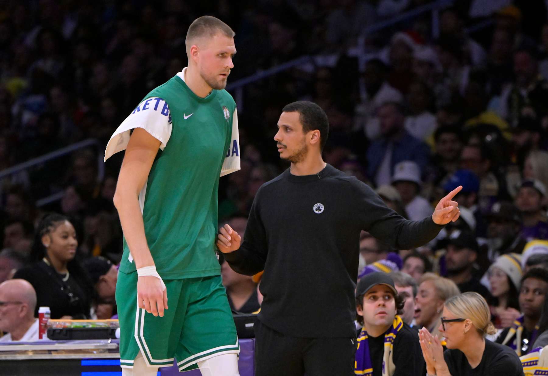LOS ANGELES, CALIFORNIA - DECEMBER 25:  Head coach Joe Mazzulla talks with Kristaps Porzingis #8 of the Boston Celtics during a break in play against the Los Angeles Lakers at Crypto.com Arena on December 25, 2023 in Los Angeles, California. NOTE TO USER: User expressly acknowledges and agrees that, by downloading and or using this photograph, User is consenting to the terms and conditions of the Getty Images License Agreement.(Photo by Jayne Kamin-Oncea/Getty Images)