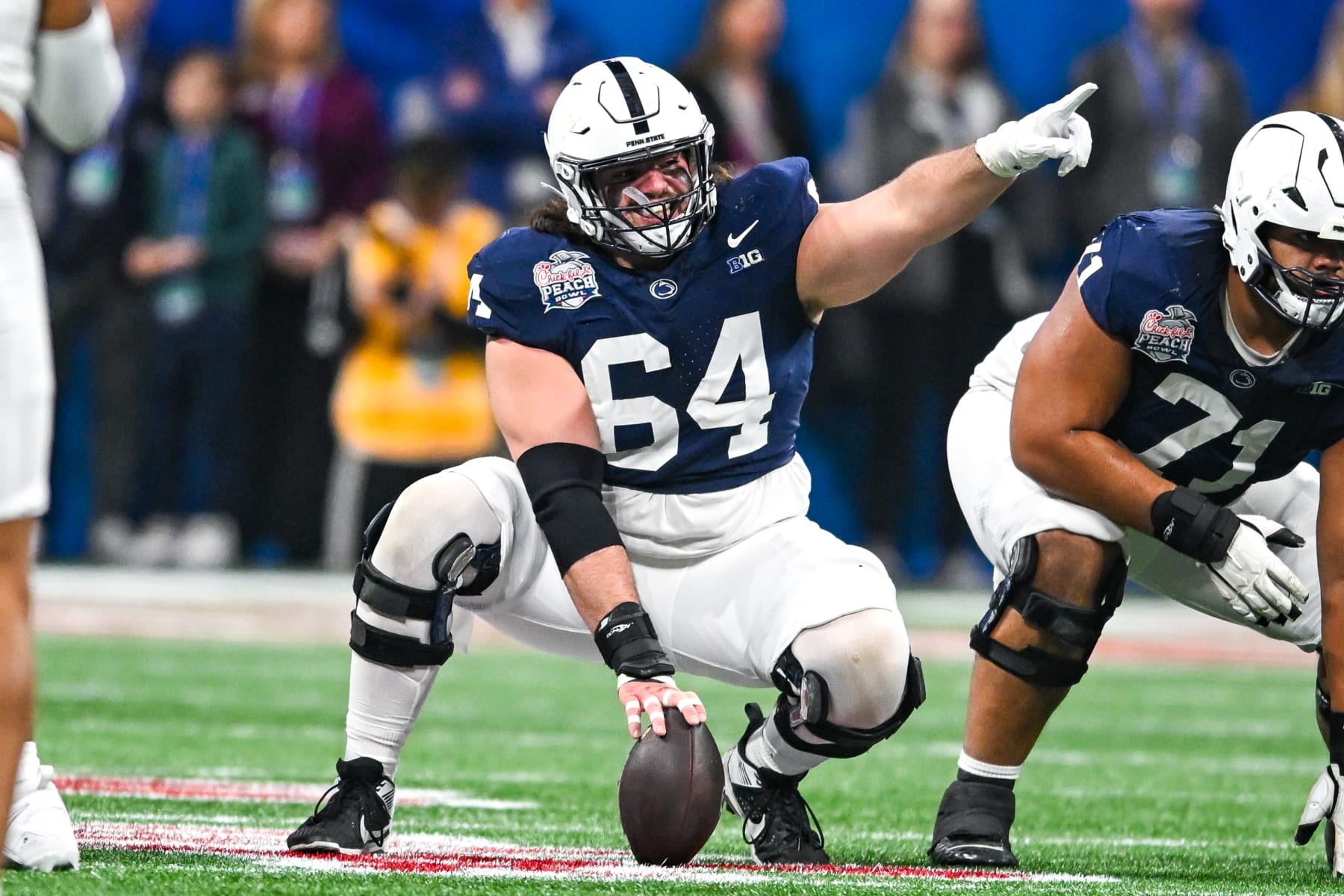 ATLANTA, GA  DECEMBER 30:  Penn State offensive lineman Hunter Nourzad (64) gestures during the Chick-fil-A Peach Bowl game between the Ole Miss Rebels and the Penn State Nittany Lions on December 30th, 2023 at Mercedes-Benz Stadium in Atlanta, GA.  (Photo by Rich von Biberstein/Icon Sportswire via Getty Images)