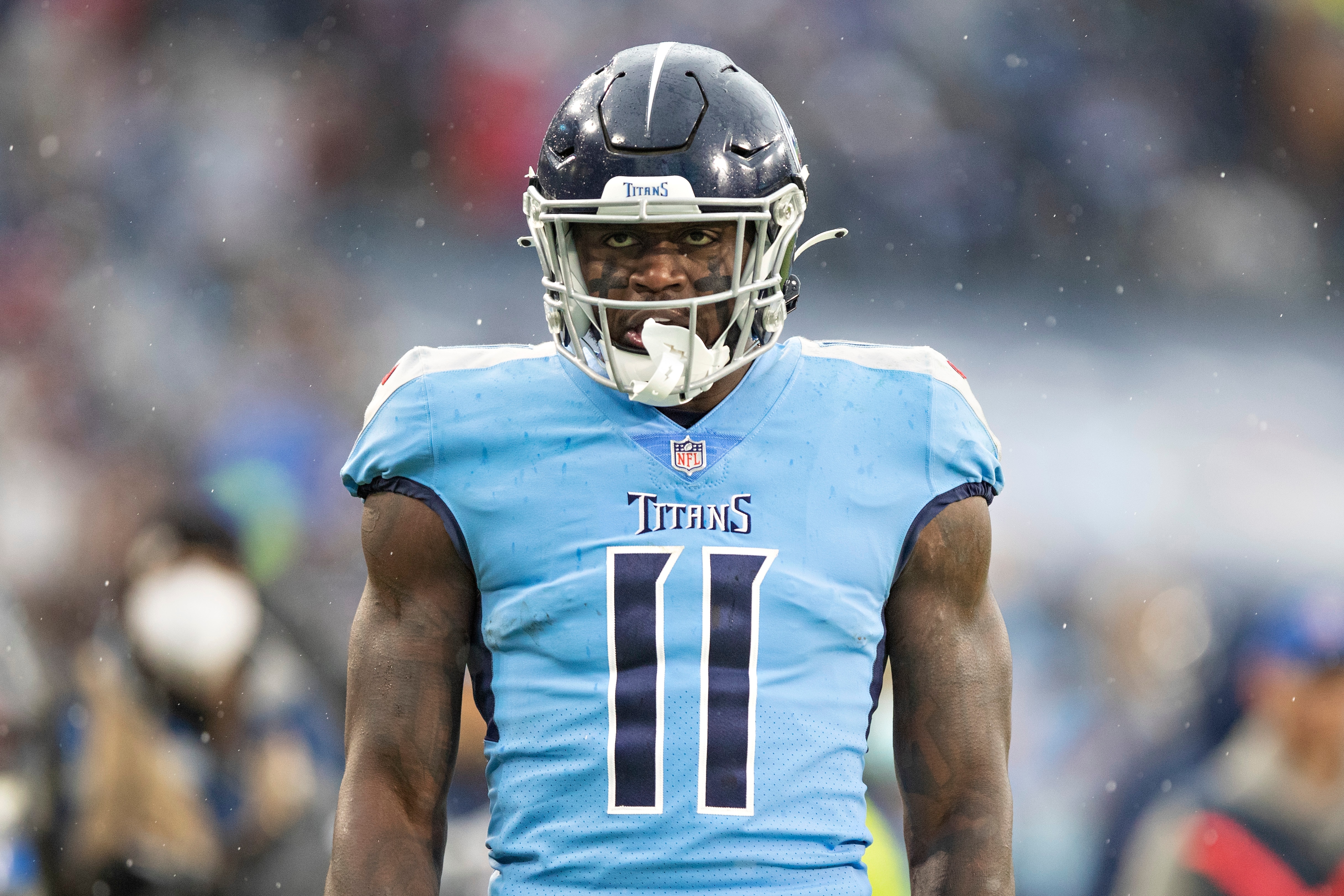 NASHVILLE, TENNESSEE - JANUARY 2:  A.J. Brown #11 of the Tennessee Titans celebrates after catching a pass during a game against the Miami Dolphins at Nissan Stadium on January 2, 2022 in Nashville, Tennessee.  The Titans defeated the Dolphins 34-3.  (Photo by Wesley Hitt/Getty Images)