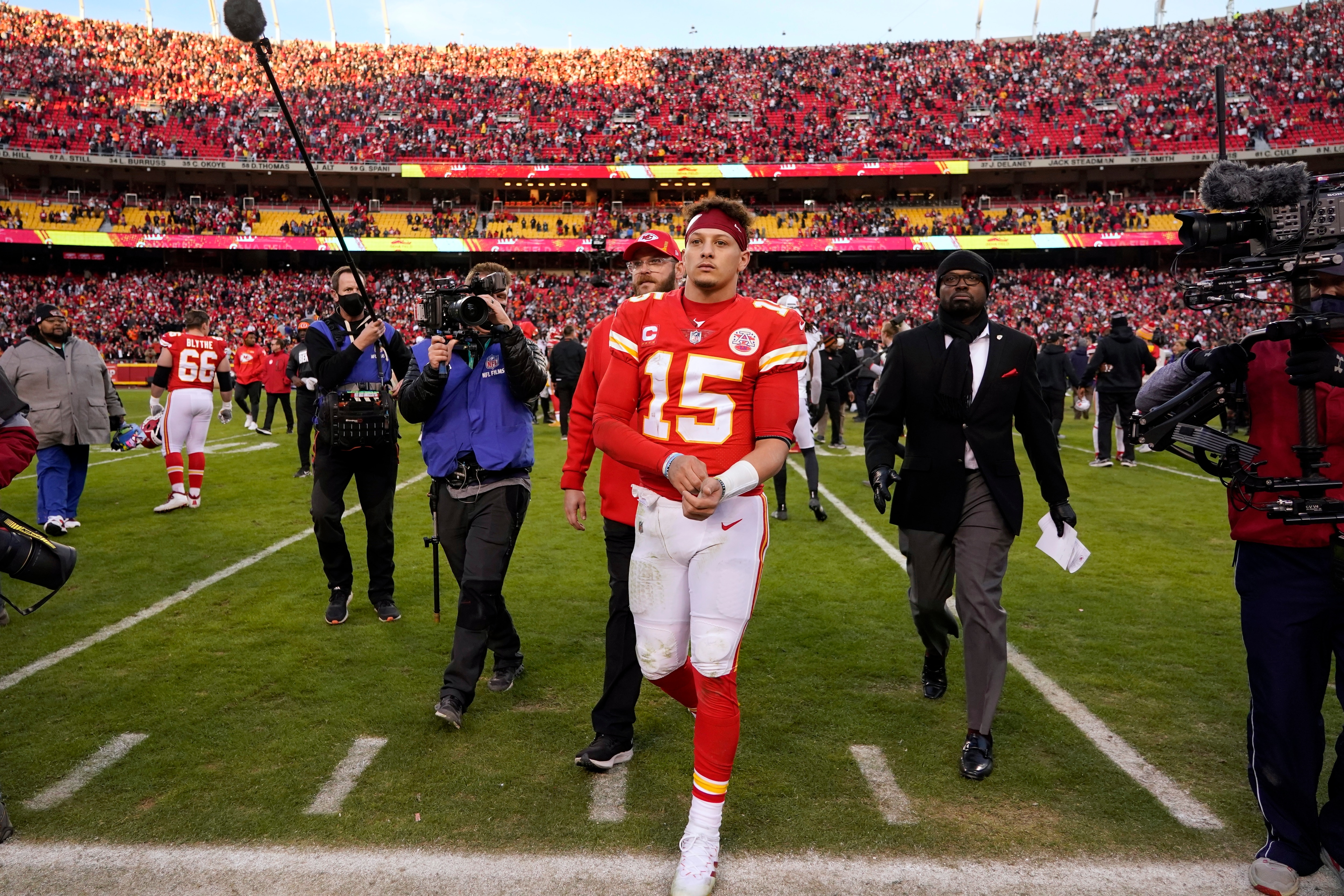Kansas City Chiefs quarterback Patrick Mahomes (15) walks off the field at the end of the AFC championship NFL football game against the Cincinnati Bengals, Sunday, Jan. 30, 2022, in Kansas City, Mo. The Bengals won 27-24 overtime. (AP Photo/Ed Zurga)