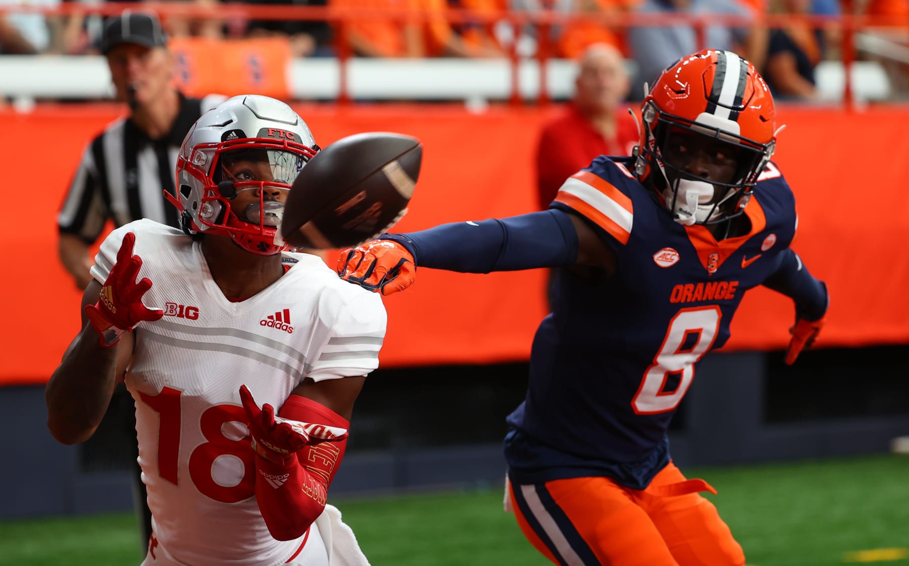 SYRACUSE, NY - SEPTEMBER 11:  Rutgers Scarlet Knights wide receiver Bo Melton (18) attempts to make a catch against Syracuse Orange defensive back Garrett Williams (8) during the college football game between the Syracuse Orange and the Rutgers Scarlet Knights on Septekmber 11, 2021at the Carrier Dome in Syracuse,NY. (Photo by Rich Graessle/Icon Sportswire via Getty Images)