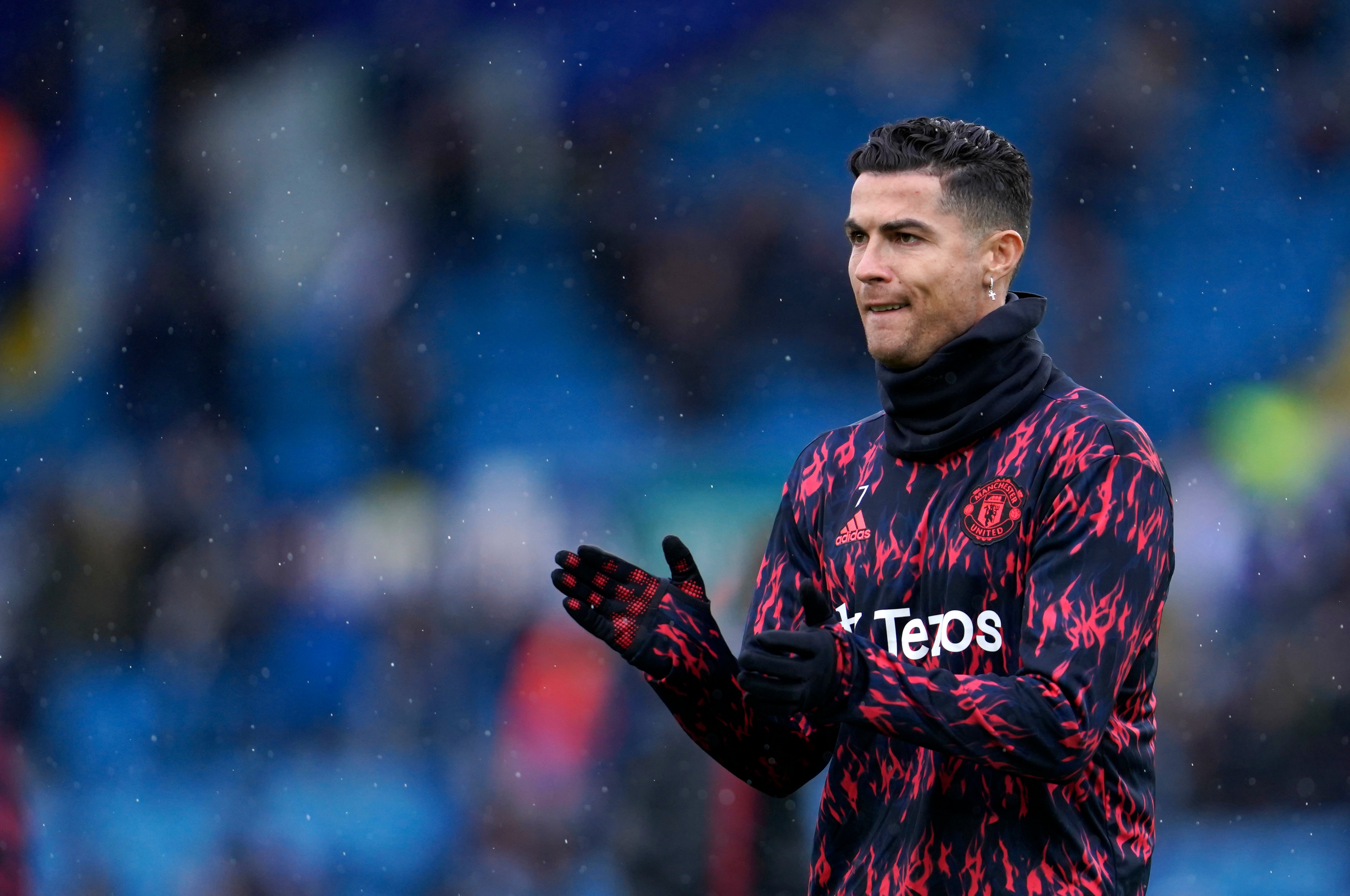 Manchester United's Cristiano Ronaldo applauds during warm up before the English Premier League soccer match between Leeds United and Manchester United, at Elland Road Stadium in Leeds, England, Sunday, Feb. 20, 2022. (AP Photo/Jon Super)