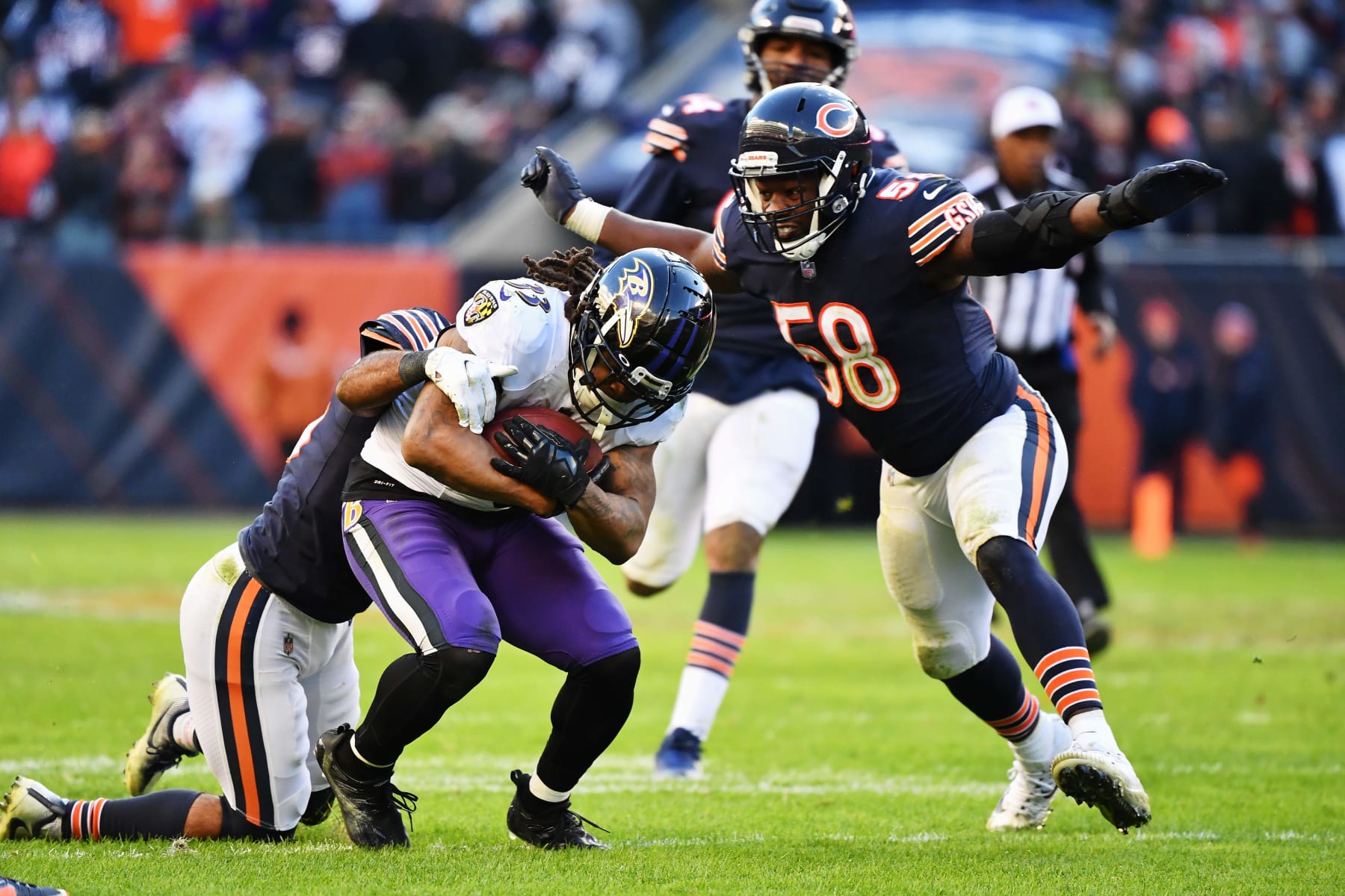 CHICAGO, ILLINOIS - NOVEMBER 21:  Roquan Smith #58 of the Chicago Bears moves in to make a tackle against the Baltimore Ravens at Soldier Field on November 21, 2021 in Chicago, Illinois.  (Photo by Jamie Sabau/Getty Images)