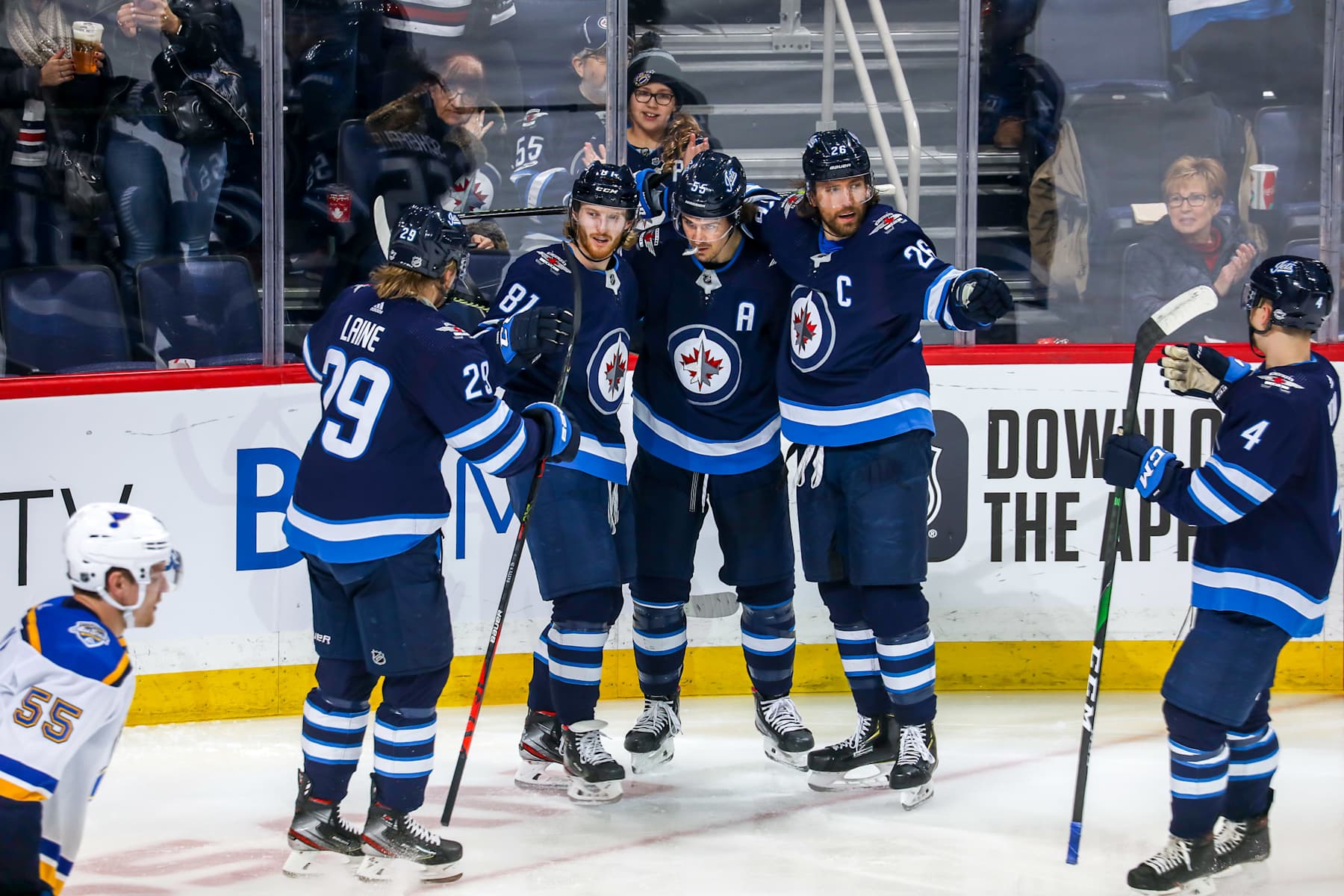 Winnipeg Jets forwards Kyle Connor and Mark Scheifele with former team captain Blake Wheeler. 