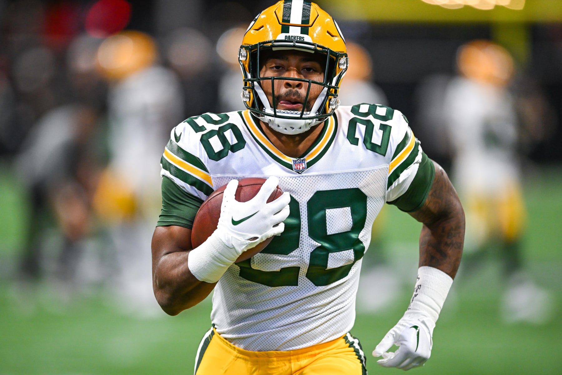 ATLANTA, GA  SEPTEMBER 17:  Green Bay running back AJ Dillon (28) warms up prior to the start of the NFL game between the Green Bay Packers and the Atlanta Falcons on September 17th, 2023 at Mercedes-Benz Stadium in Atlanta, GA.  (Photo by Rich von Biberstein/Icon Sportswire via Getty Images)