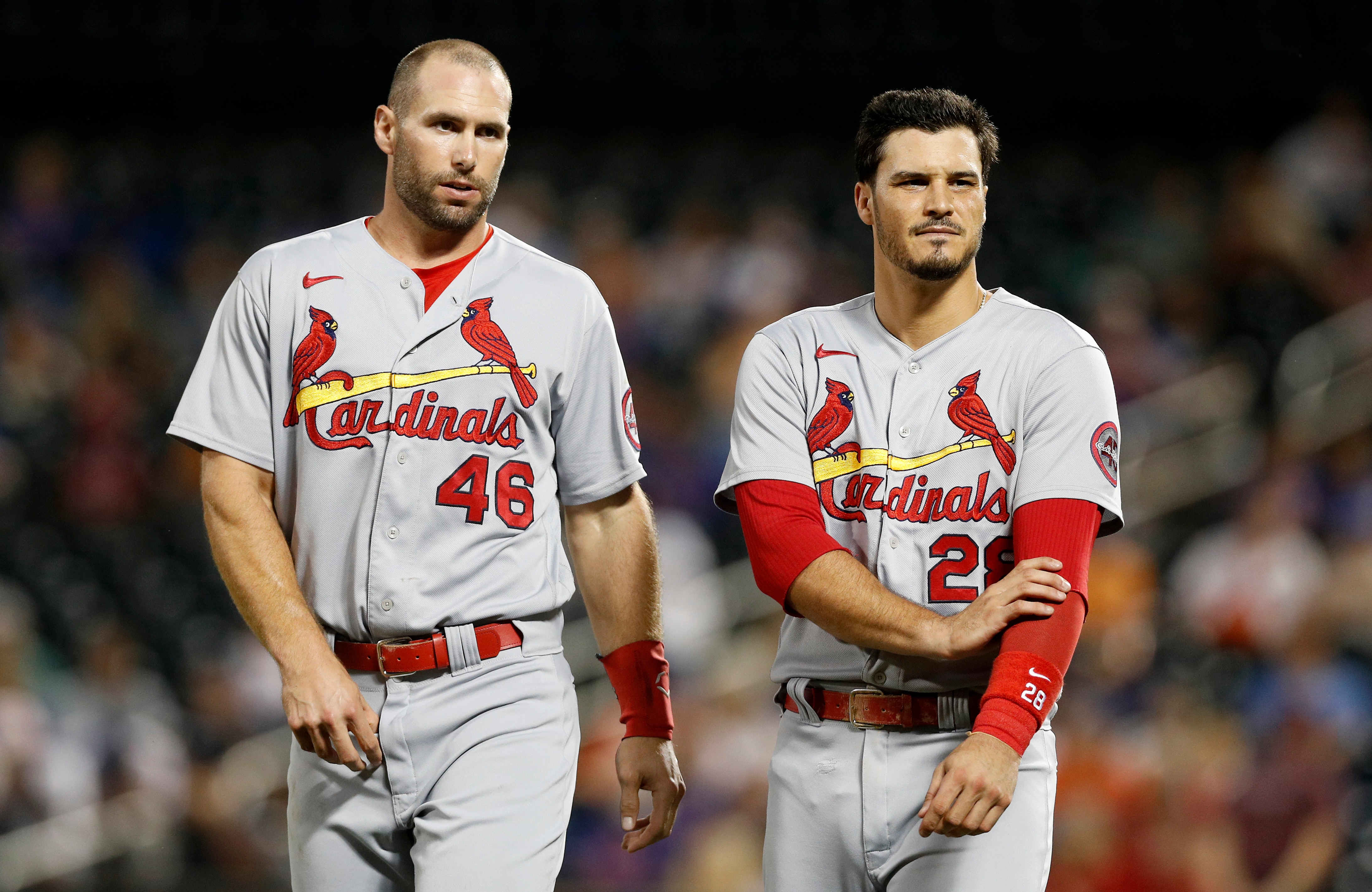 NEW YORK, NEW YORK - SEPTEMBER 14:  Paul Goldschmidt #46 and Nolan Arenado #28 of the St. Louis Cardinals look on after the first inning against the New York Mets at Citi Field on September 14, 2021 in New York City. The Cardinals defeated the Mets 7-6 in eleven innings. (Photo by Jim McIsaac/Getty Images)