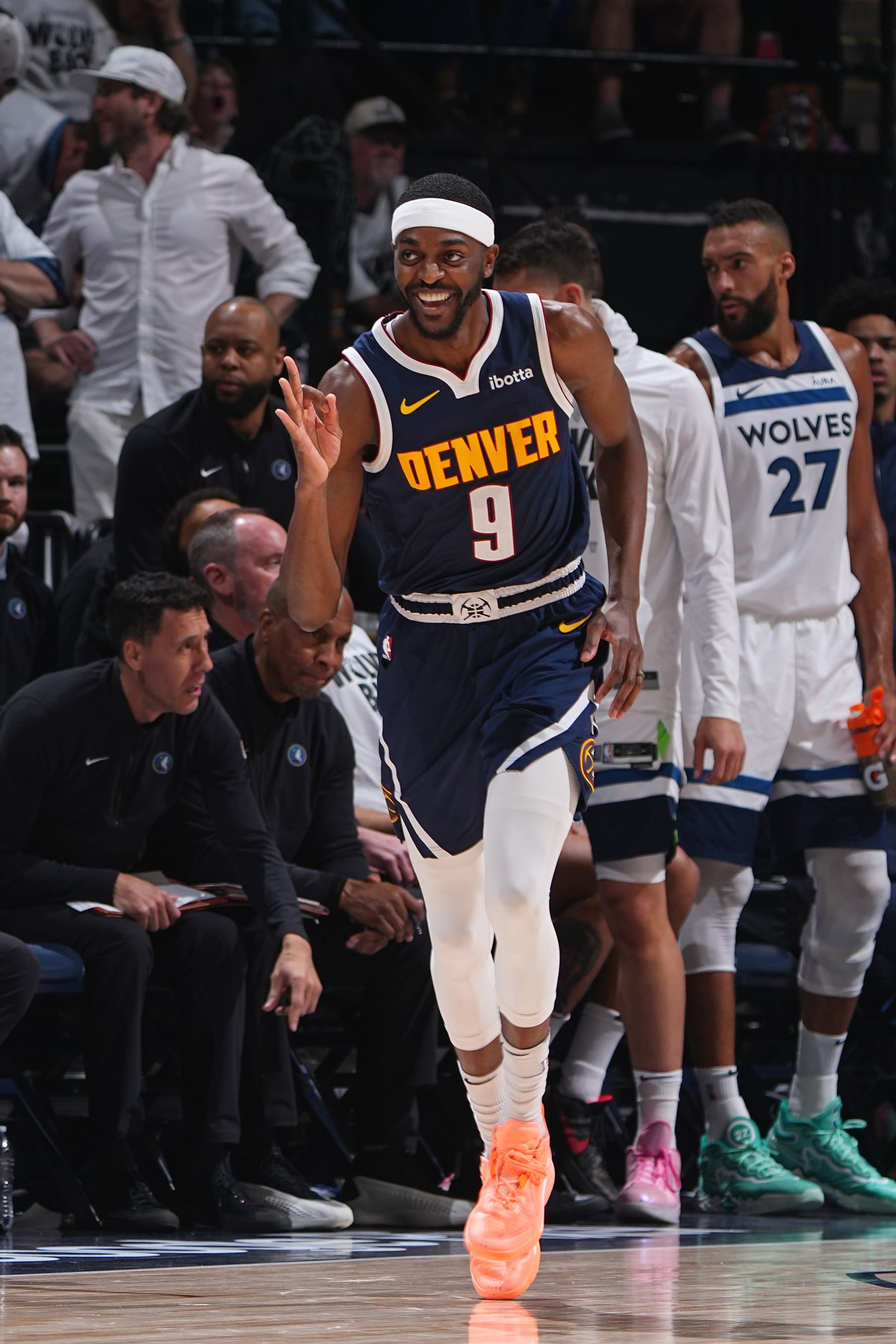 MINNEAPOLIS, MN - MAY 12: Justin Holiday #9 of the Denver Nuggets celebrates during the game against the Minnesota Timberwolves during Round 2 Game 4 of the 2024 NBA Playoffs on May 12, 2024 at Target Center in Minneapolis, Minnesota. NOTE TO USER: User expressly acknowledges and agrees that, by downloading and/or using this Photograph, user is consenting to the terms and conditions of the Getty Images License Agreement. Mandatory Copyright Notice: Copyright 2024 NBAE (Photo by Garrett Ellwood/NBAE via Getty Images)
