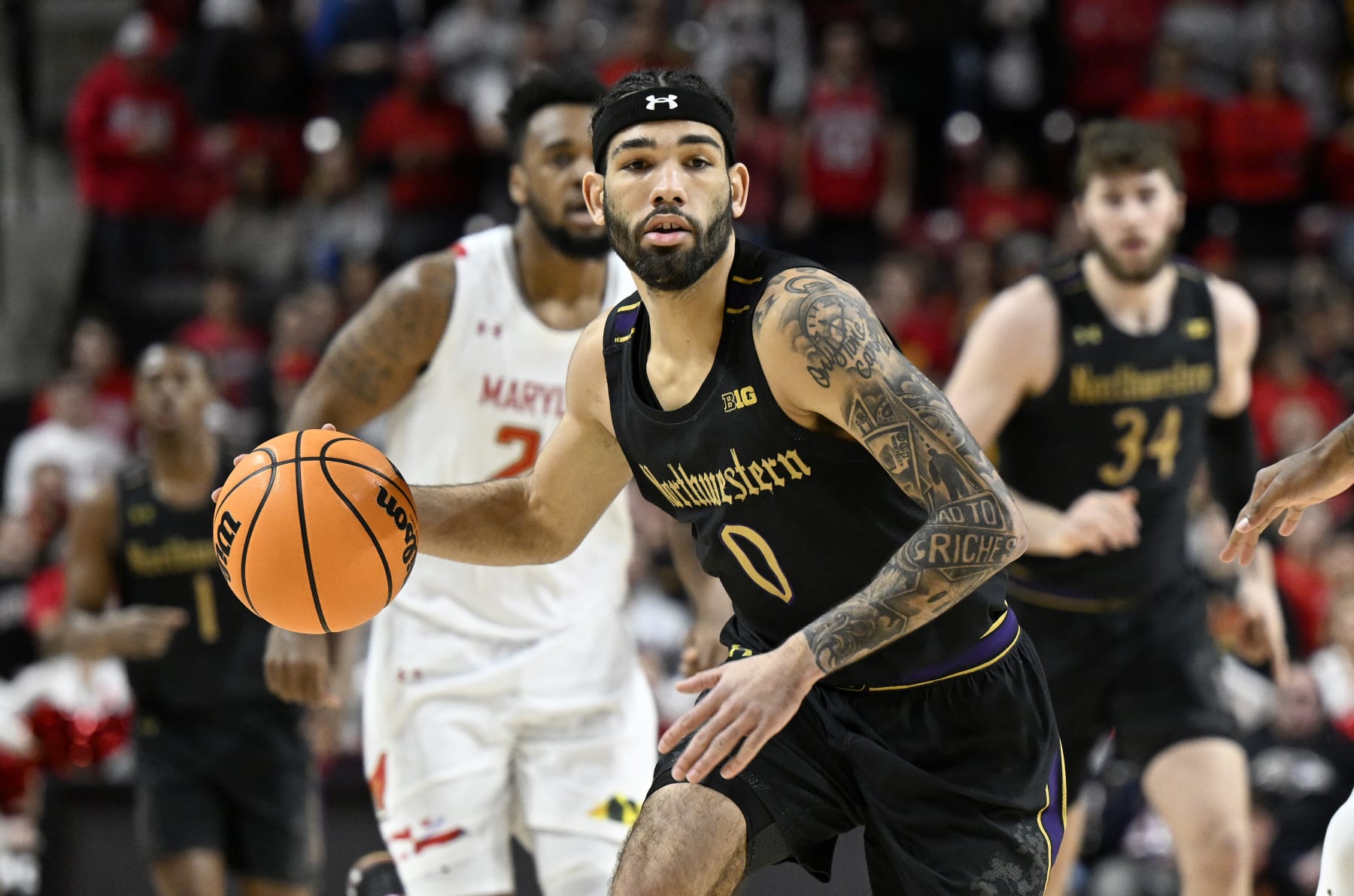 COLLEGE PARK, MARYLAND - FEBRUARY 26: Boo Buie #0 of the Northwestern Wildcats handles the ball against the Maryland Terrapins at Xfinity Center on February 26, 2023 in College Park, Maryland. (Photo by G Fiume/Getty Images)