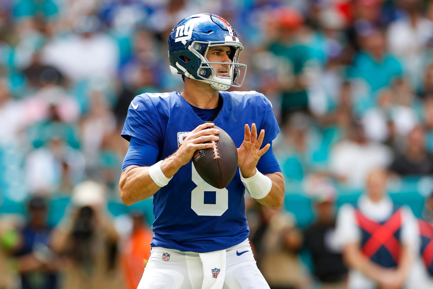 MIAMI GARDENS, FLORIDA - OCTOBER 08: Daniel Jones #8 of the New York Giants looks for an open receiver against the Miami Dolphins in the first half at Hard Rock Stadium on October 8, 2023 in Miami Gardens, Florida. (Photo by Brandon Sloter/Image Of Sport/Getty Images)