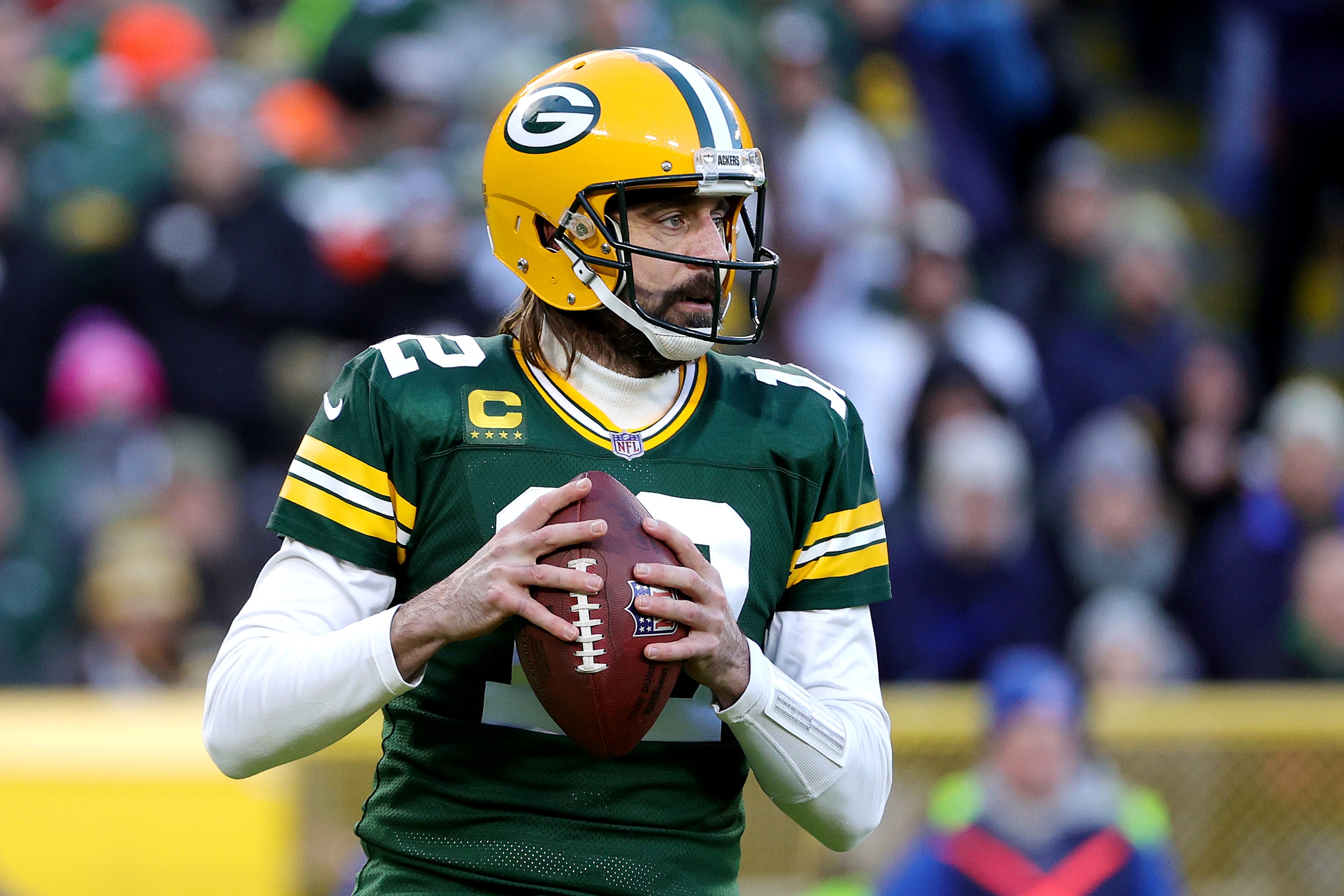 GREEN BAY, WISCONSIN - NOVEMBER 28: Aaron Rodgers #12 of the Green Bay Packers looks to throw the ball during the first quarter against the Los Angeles Rams at Lambeau Field on November 28, 2021 in Green Bay, Wisconsin. (Photo by Stacy Revere/Getty Images)