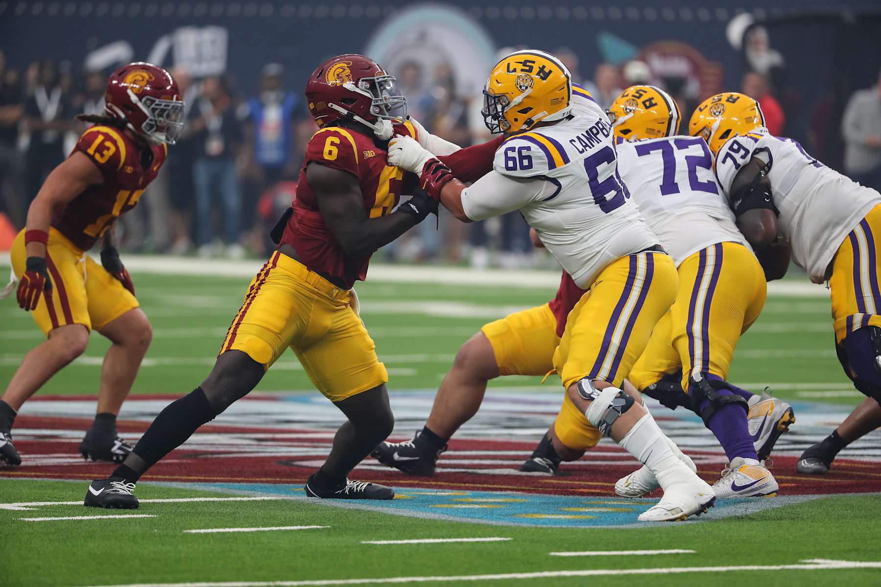 LAS VEGAS, NV - SEPTEMBER 01: USC Trojans defensive end Anthony Lucas (6) battles with LSU Tigers offensive tackle Will Campbell (66) during the Modelo Vegas Kickoff Classic featuring the USC Trojans versus the LSU Tigers on September 1, 2024 at Allegiant Stadium in Las Vegas, Nevada. (Photo by Jevone Moore/Icon Sportswire via Getty Images)